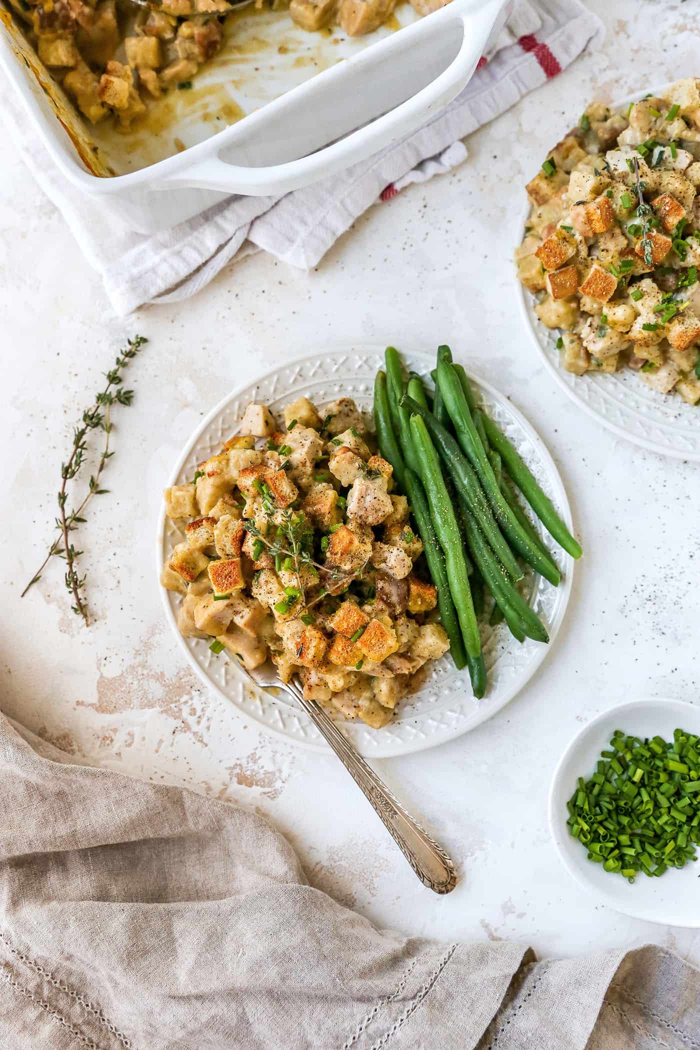 This hearty leftover turkey casserole recipe with sage, thyme, cream of chicken, and crispy stuffing is an easy way to clean out the fridge.