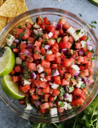 watermelon salsa in a clear bowl with tortilla chips
