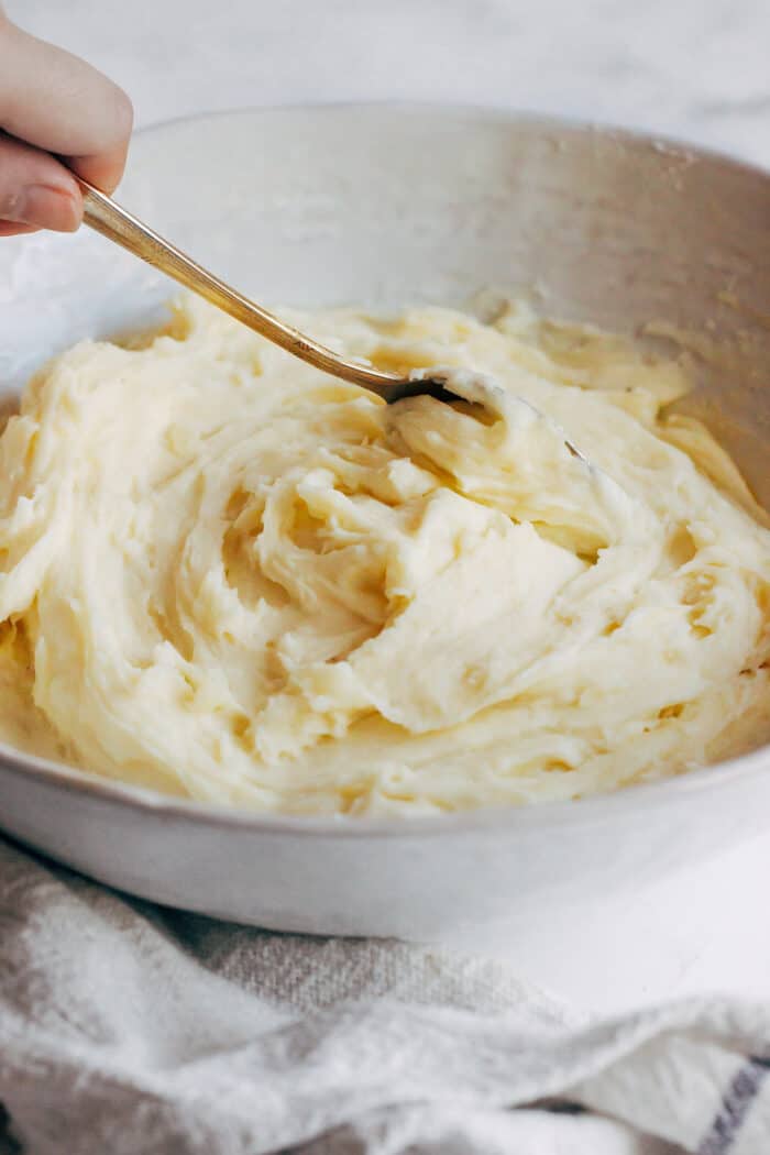 Silky mashed potatoes in a bowl.