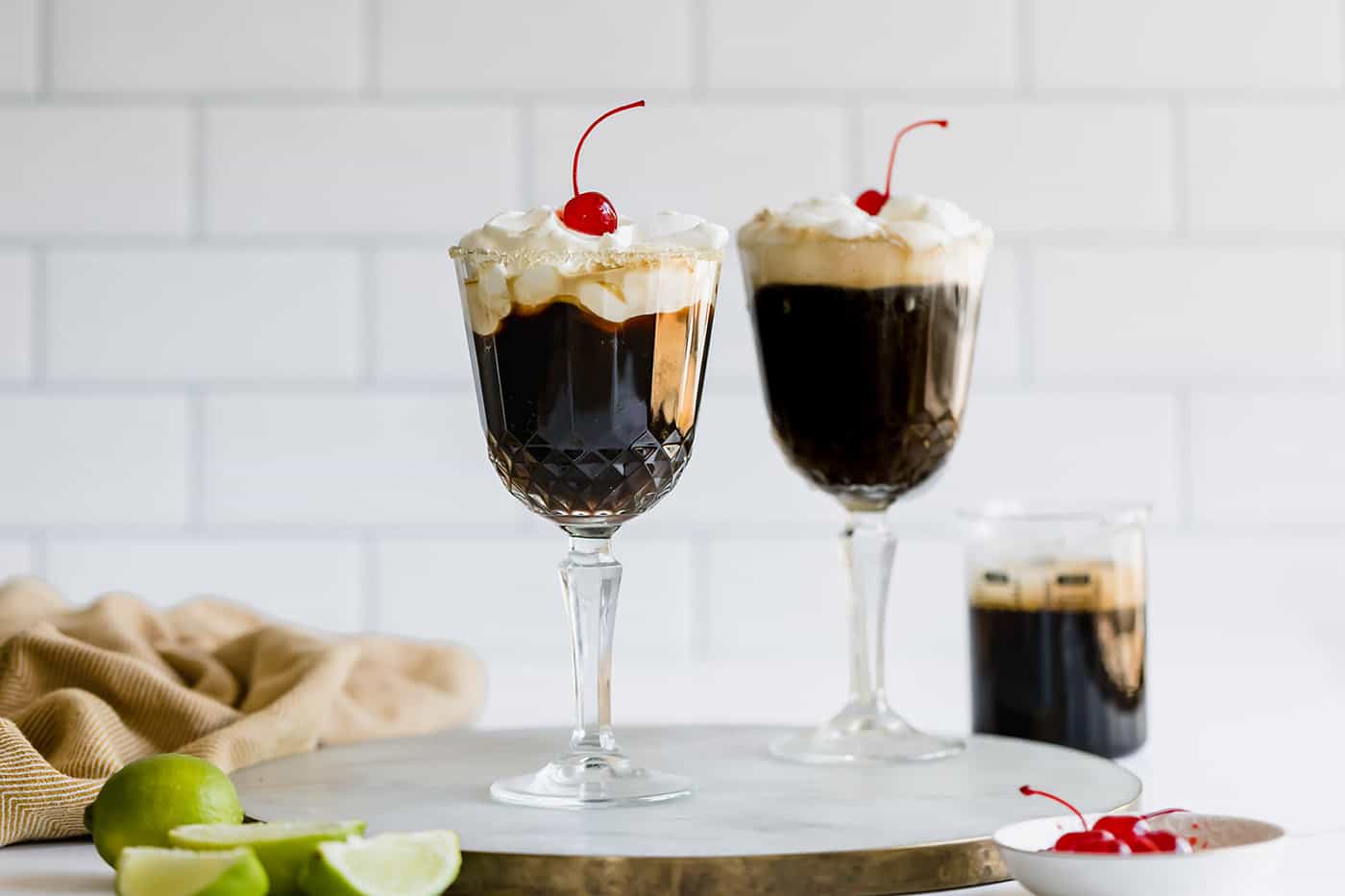 Mexican Coffee is a decadent dessert cocktail that's served hot. With tequila, Kahlua, and whipped cream, this recipe is a fun and beautiful way to top off a meal! 2 stemmed glasses of dessert coffee cocktails
