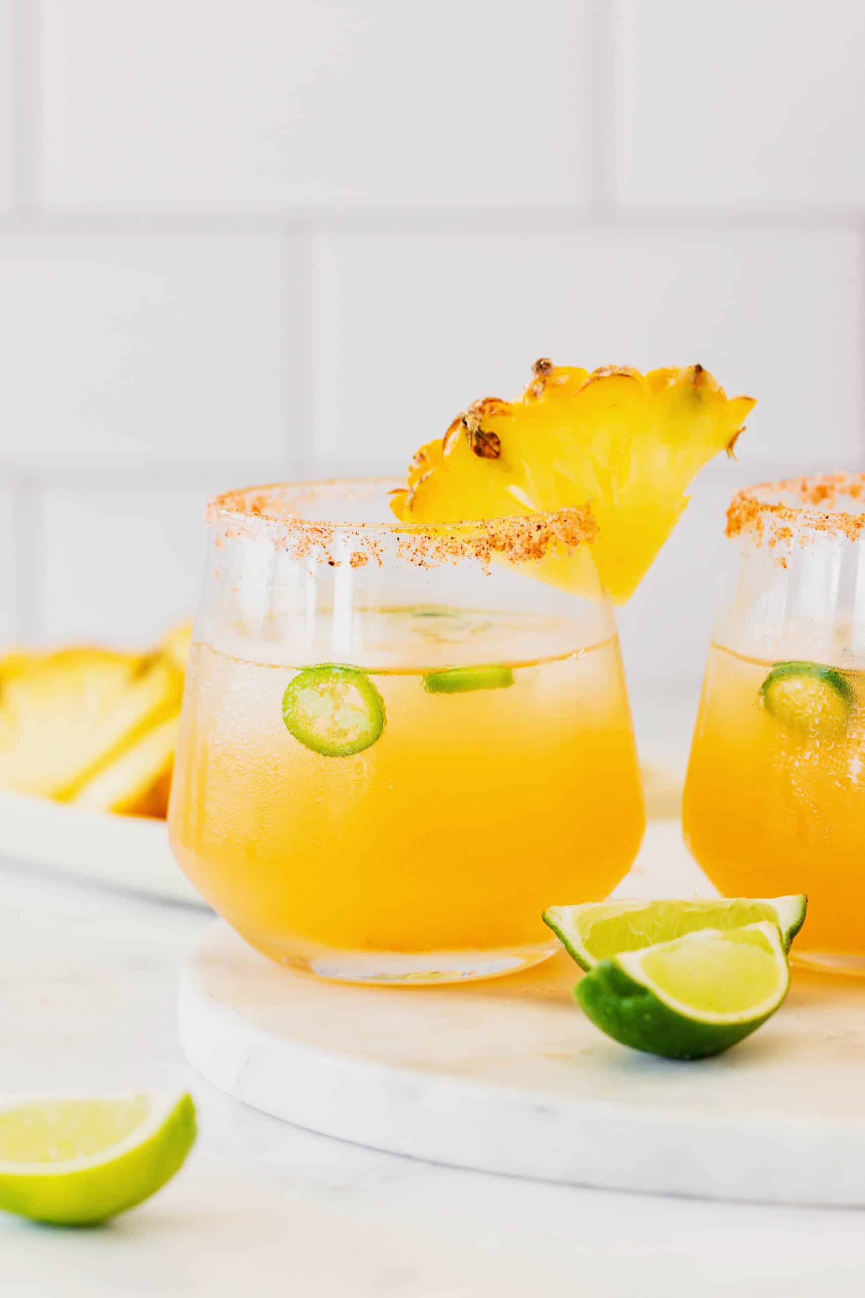 This spicy pineapple jalapeño margarita is a delicious twist on the classic cocktail with blanco tequila, fresh pineapple juice, and jalapeño. a margarita cocktail made with pineapple, jalapeno, tequila, and lime juice