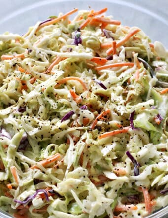 salad of shredded cabbage and carrots with a mayo and sour cream based dressing