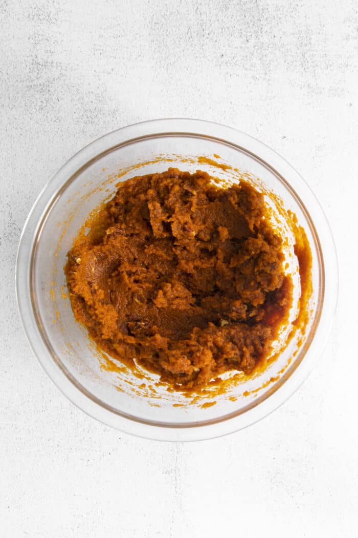 Overhead shot of pumpkin puree in glass bowl