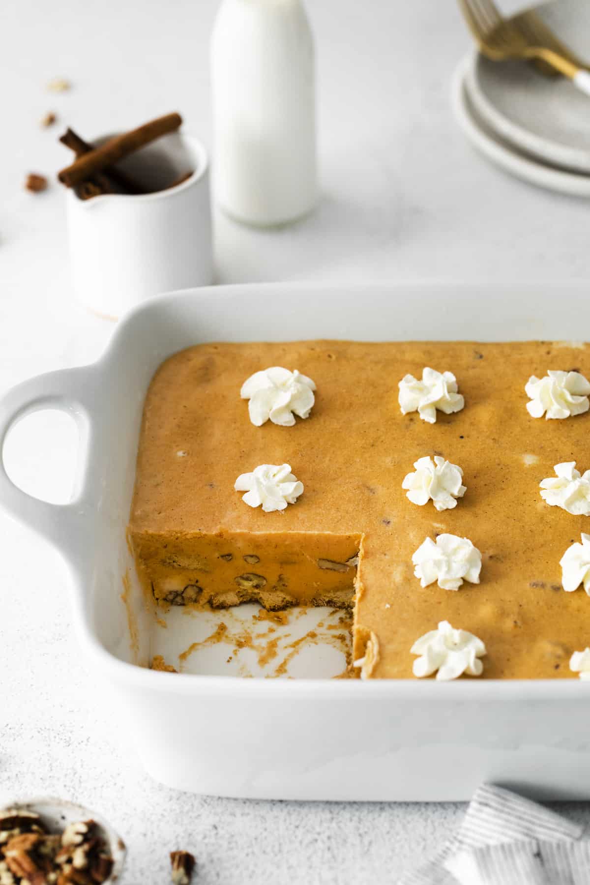 Pumpkin Icebox Cake with two pieces removed from pan