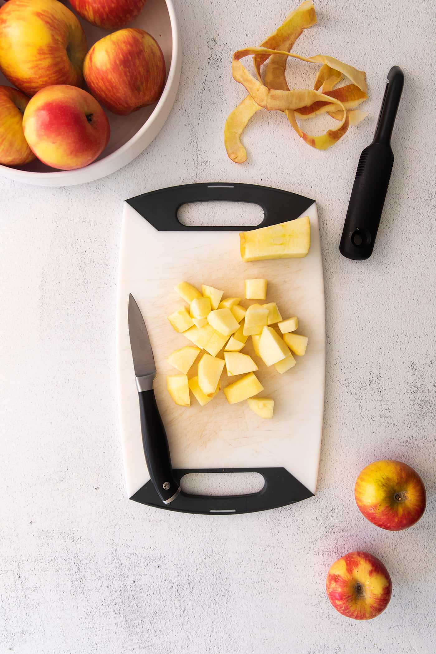 This easy homemade applesauce recipe can be made smooth or chunky, with simple refrigerator storage or canning for long-term pantry storage! peeling and cutting apples