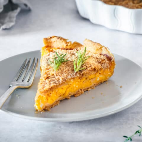 a piece of butternut squash tart on a plate