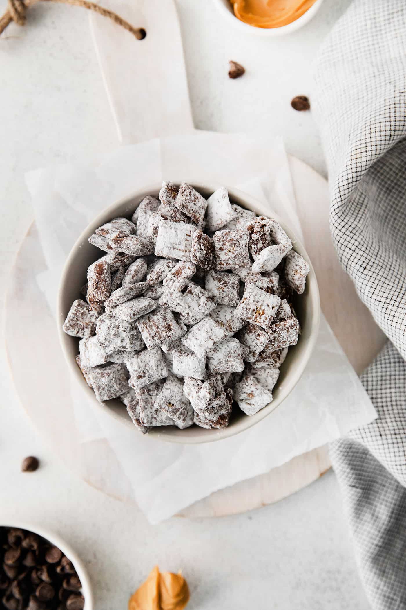 Overhead view of puppy chow in a white bowl.