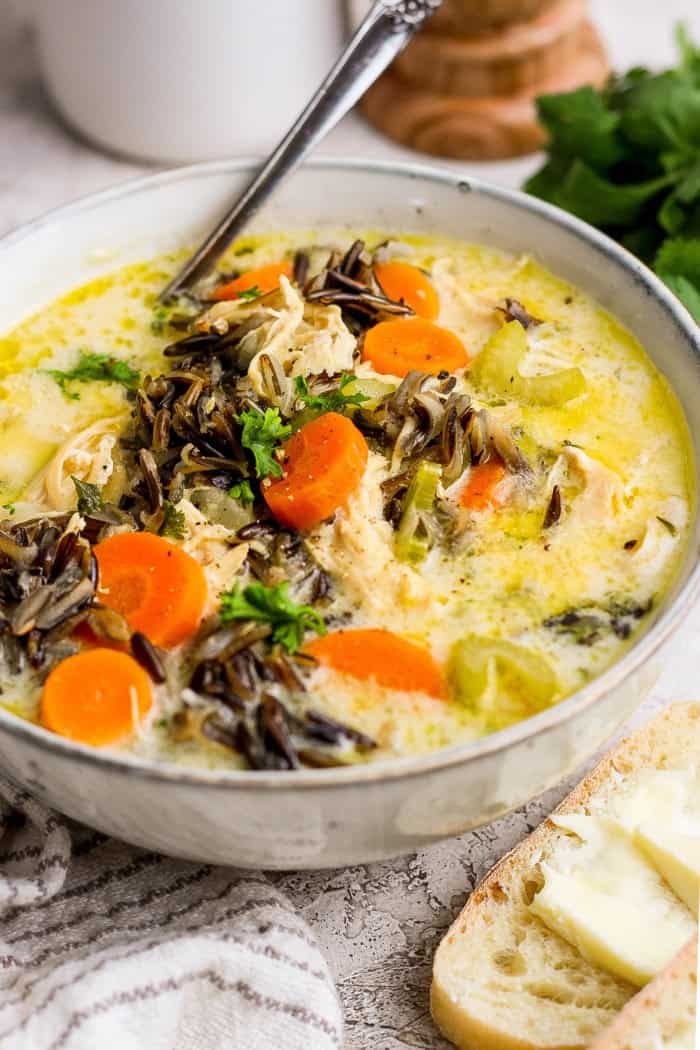 Bowl of creamy chicken wild rice soup with spoon