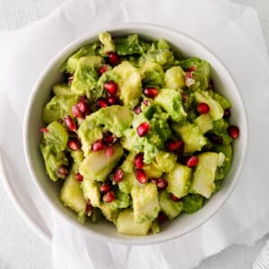 Overhead view of holiday guacamole in a bowl.