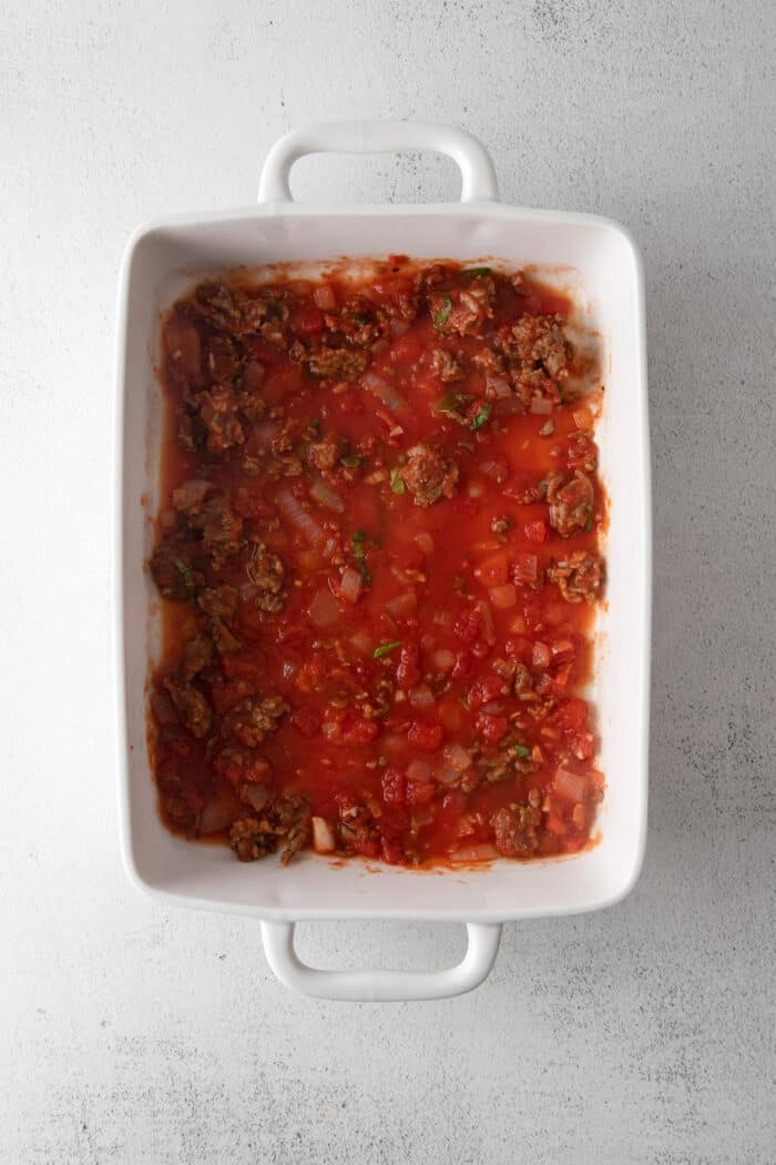 Homemade sauce spread in a white baking sheet