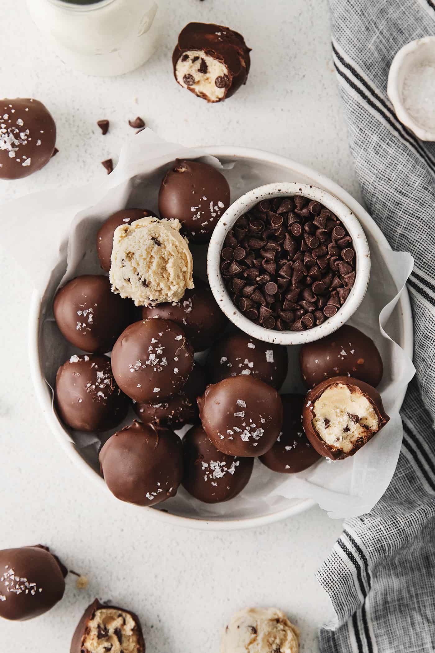 Overhead view of cookie dough truffles on a white plate