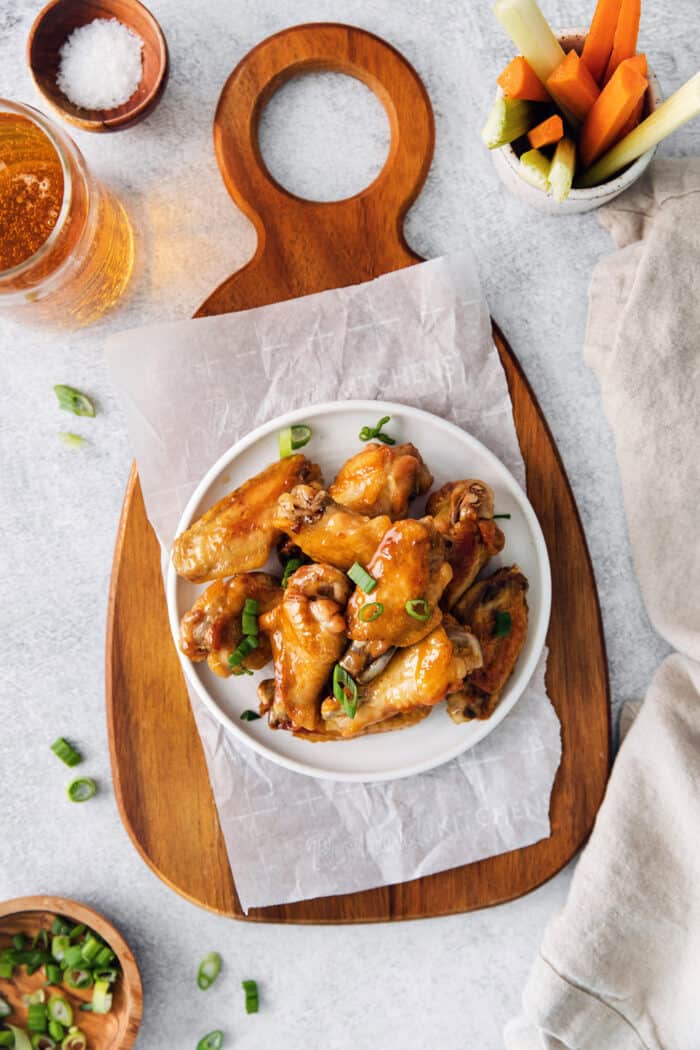 Overhead view of a plate of hot honey chicken wings
