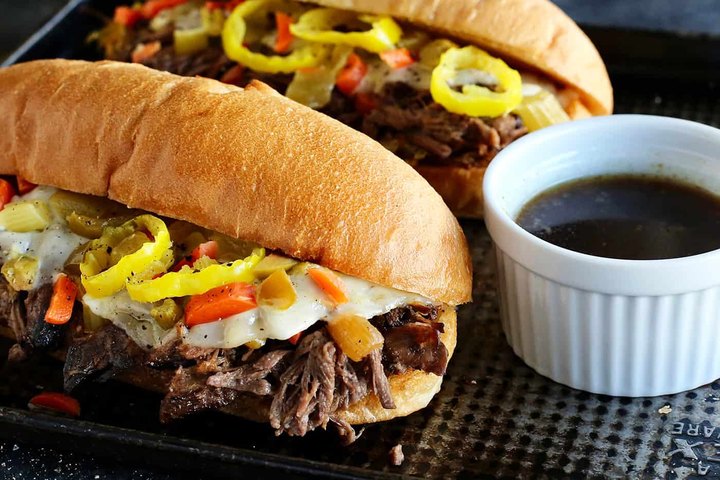 Close up of two slow cooker Italian beef sandwiches
