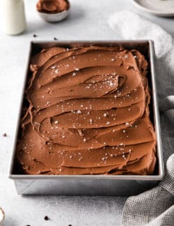 Overhead view of a pan of chocolate wacky cake with buttercream frosting