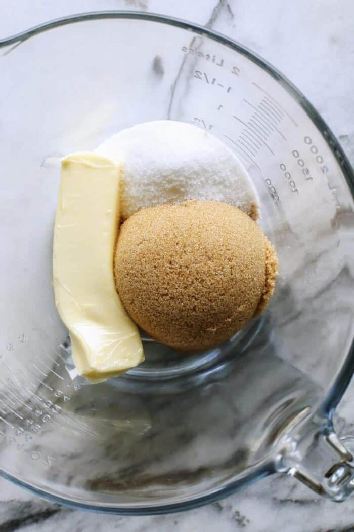 An easy edible cookie dough recipe that's egg-free and made with heat-treated flour so it's safe to eat. Refrigerate or freeze it for later! butter, granulated sugar, and brown sugar in a clear bowl