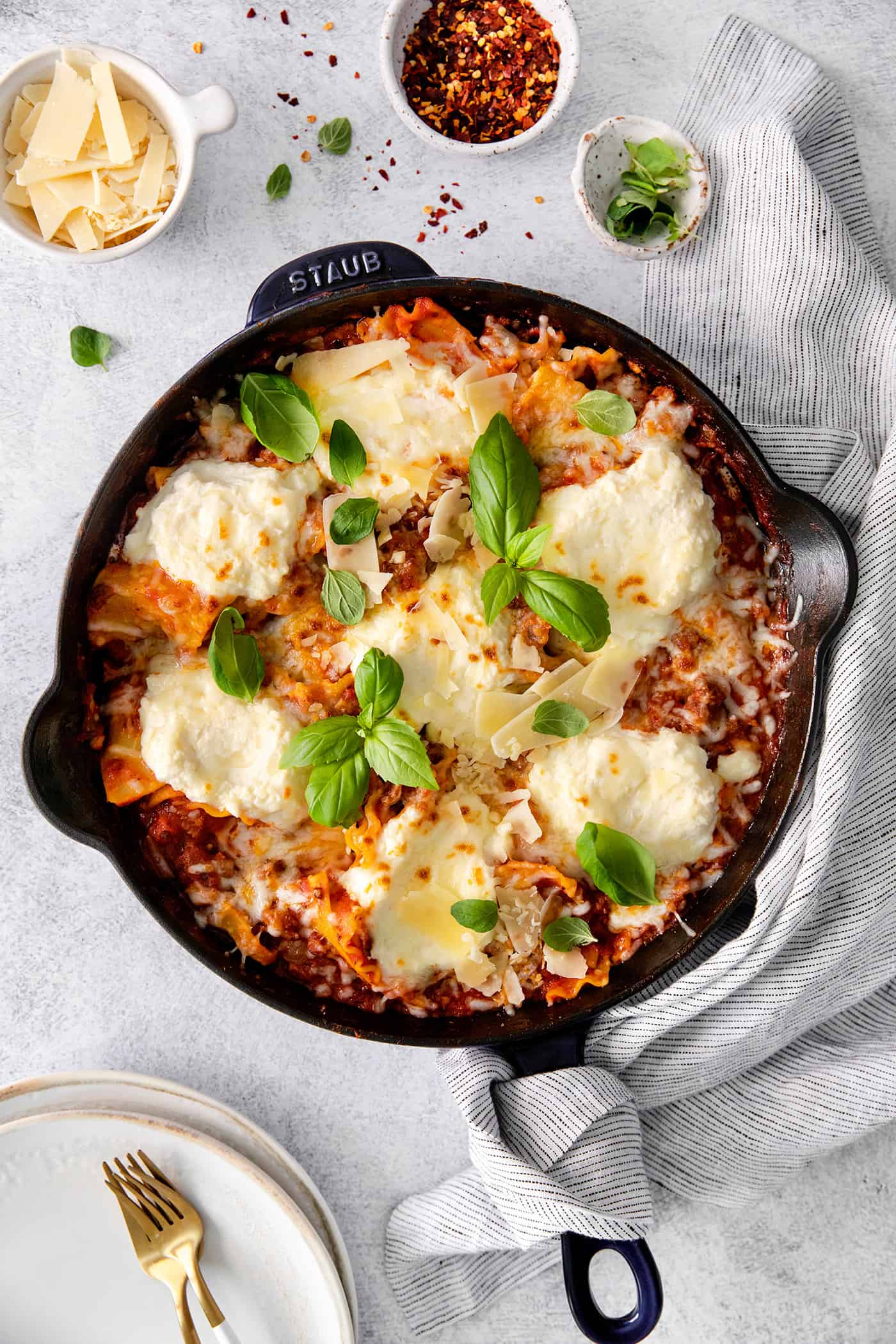 This skillet lasagna recipe has all the classic lasagna ingredients, without the extra dishes and layering! Perfect for weeknight dinners. Overhead view of skillet lasagna