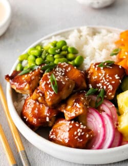Angled overhead view of a teriyaki chicken rice bowl