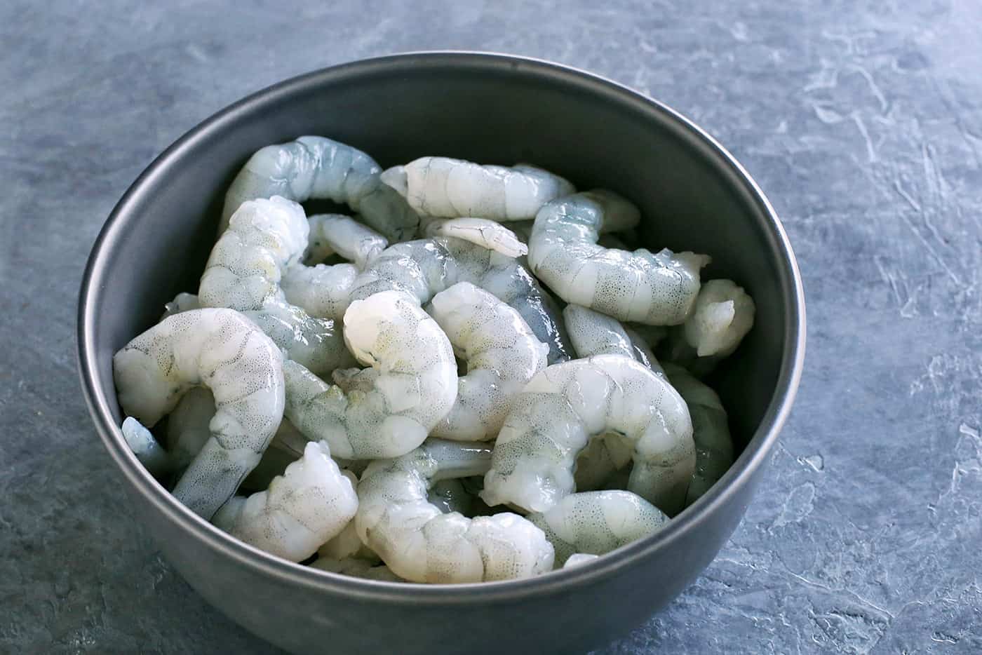 With just the right amount of heat, this Easy Shrimp Aguachile features shrimp marinated in lime juice and then tossed in a spicy marinade. A bowl of raw shrimp