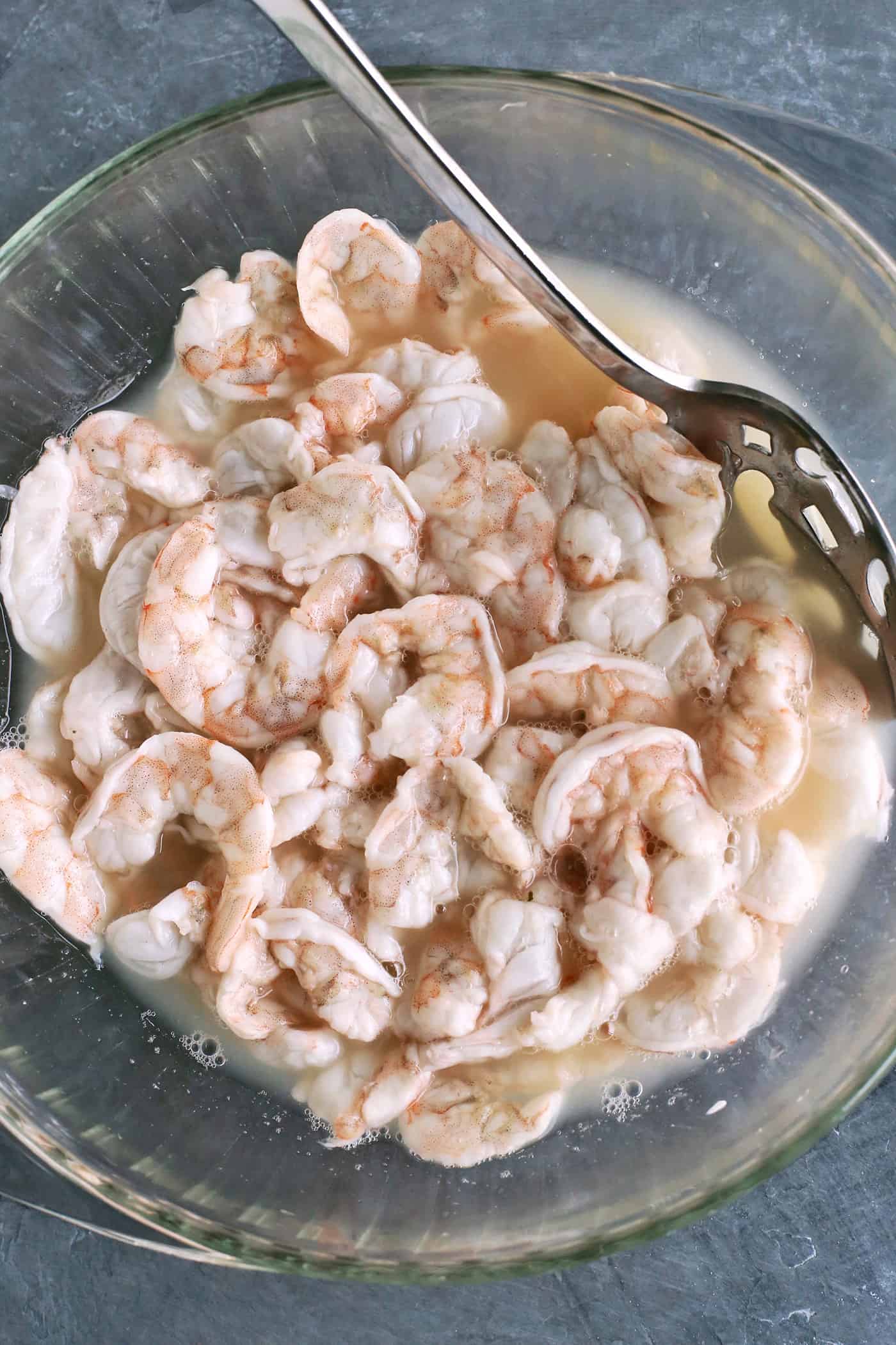With just the right amount of heat, this Easy Shrimp Aguachile features shrimp marinated in lime juice and then tossed in a spicy marinade. Shrimp marinating in lime juice