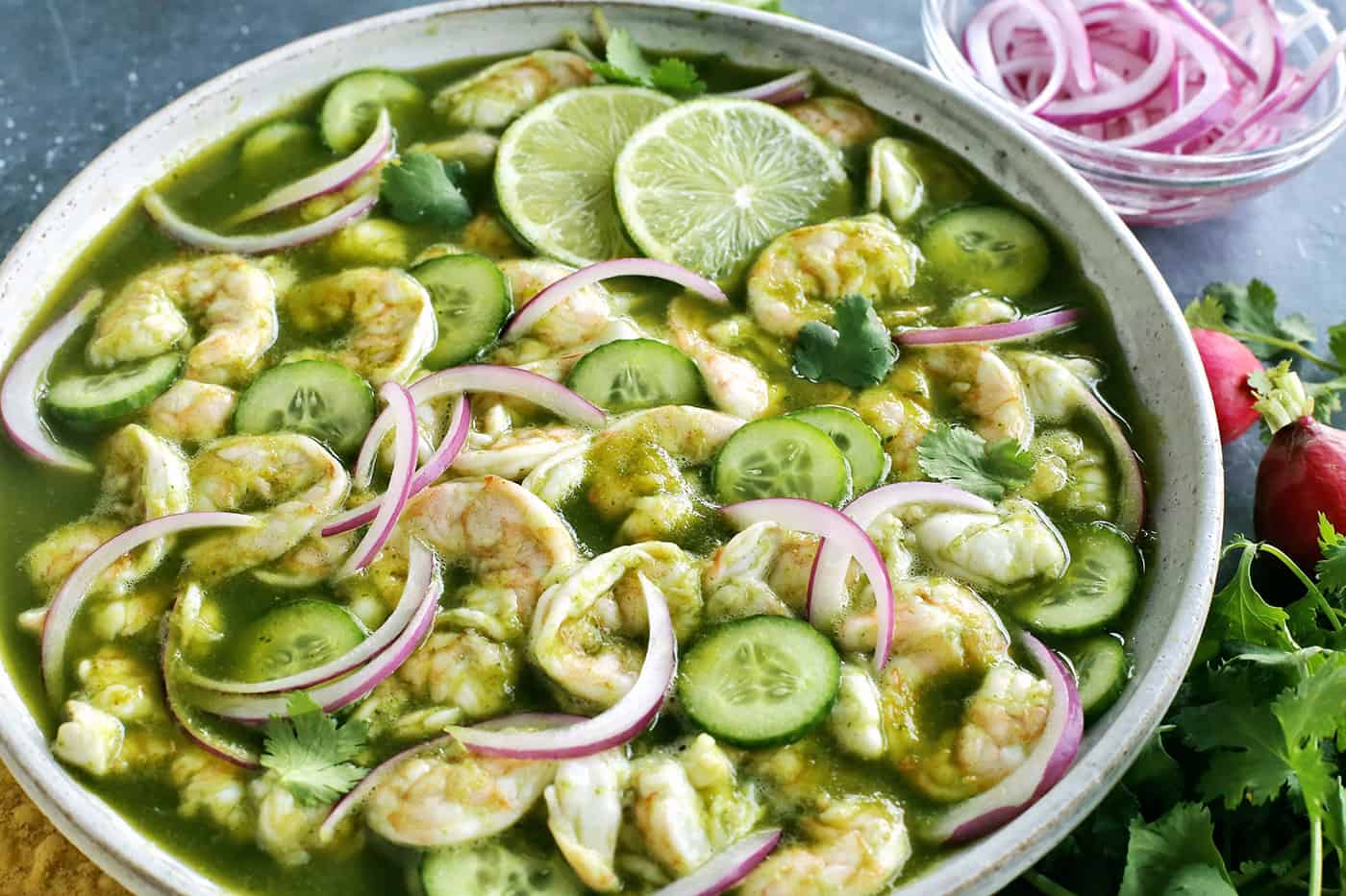 With just the right amount of heat, this Easy Shrimp Aguachile features shrimp marinated in lime juice and then tossed in a spicy marinade. Overhead view of a bowl of shrimp aguachile