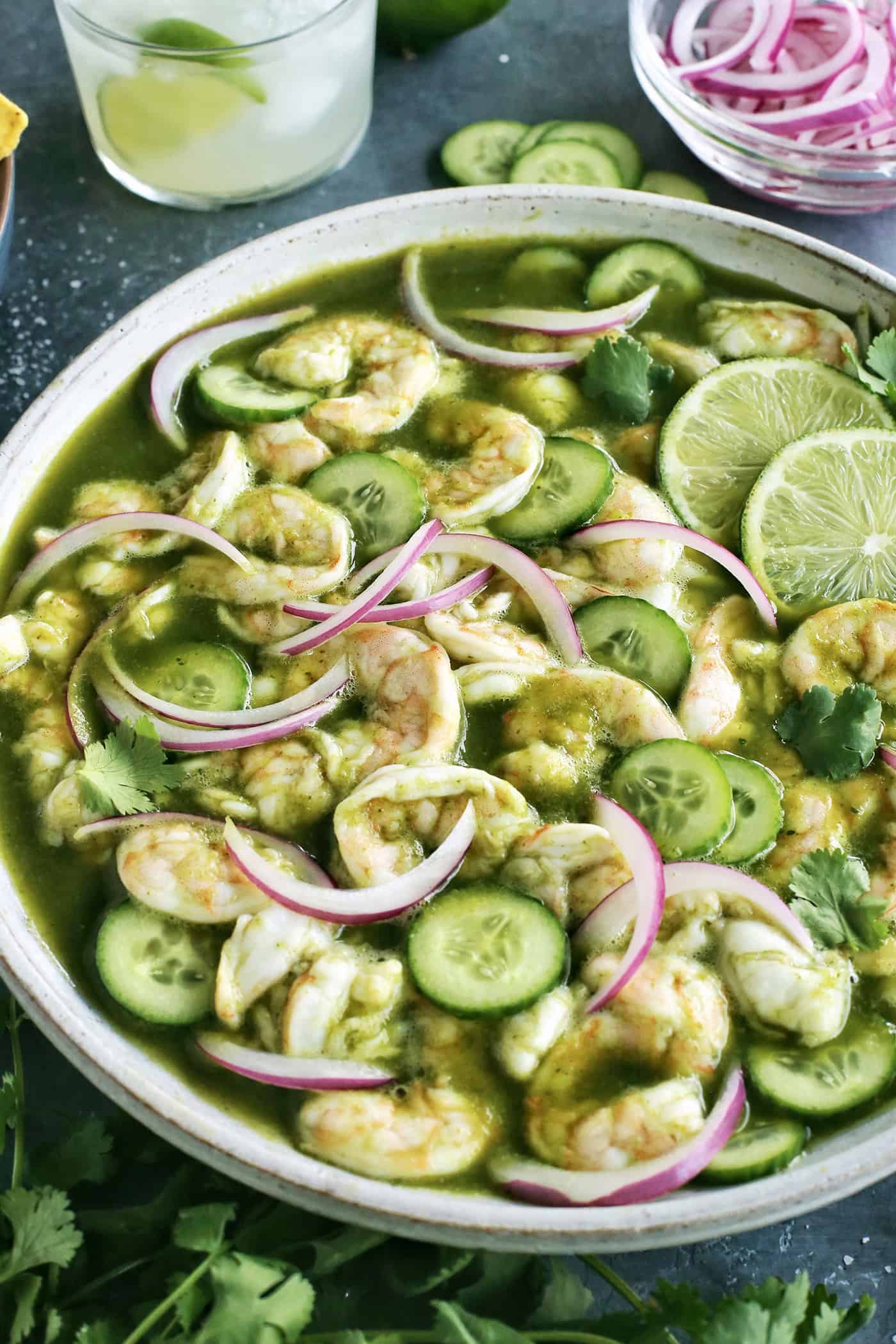 With just the right amount of heat, this Easy Shrimp Aguachile features shrimp marinated in lime juice and then tossed in a spicy marinade. Close up of shrimp aguachile