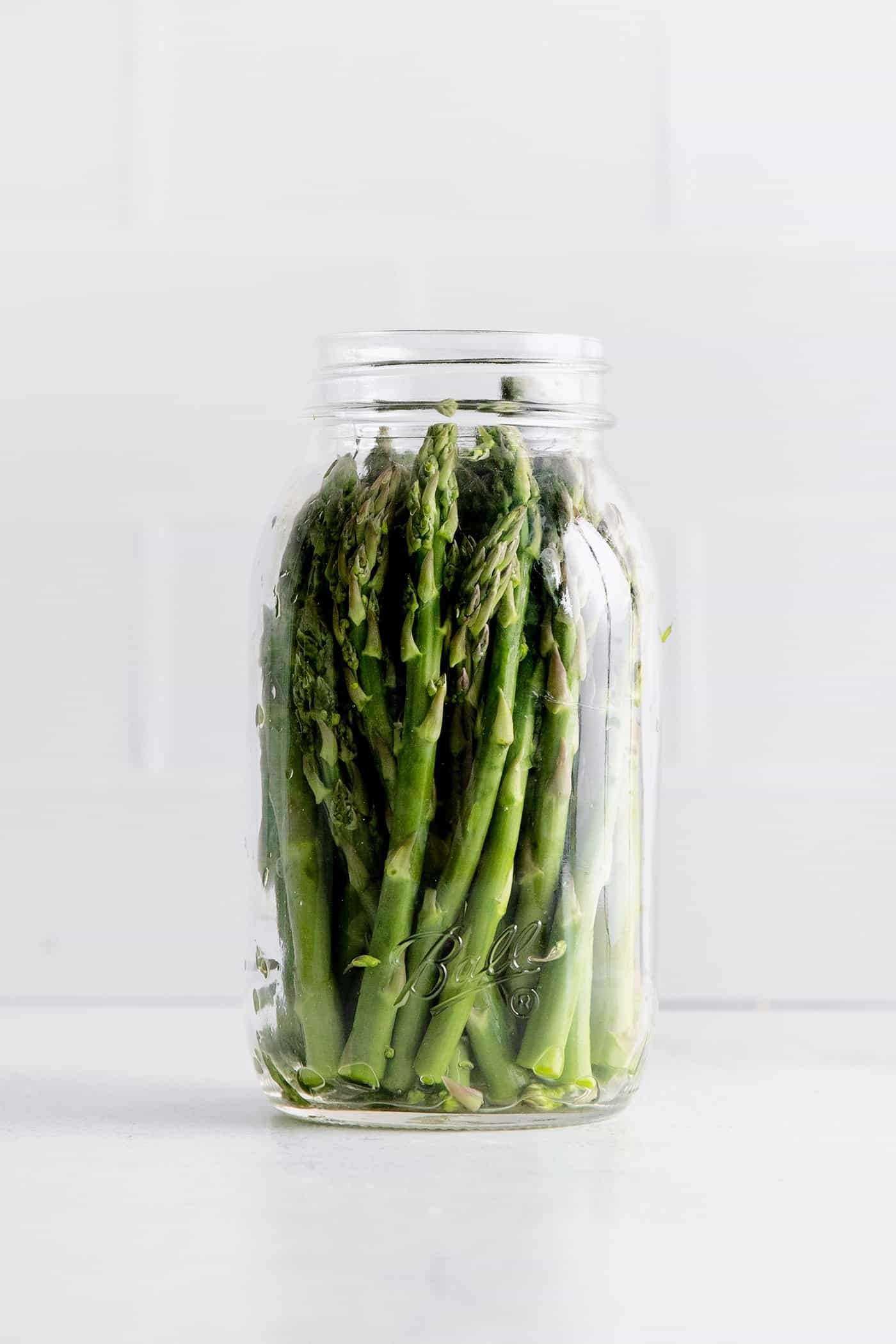 With a simple pickling brine and a few spices, these Quick Pickled Asparagus has a tangy, robust flavor with just a bit of heat. A jar of asparagus
