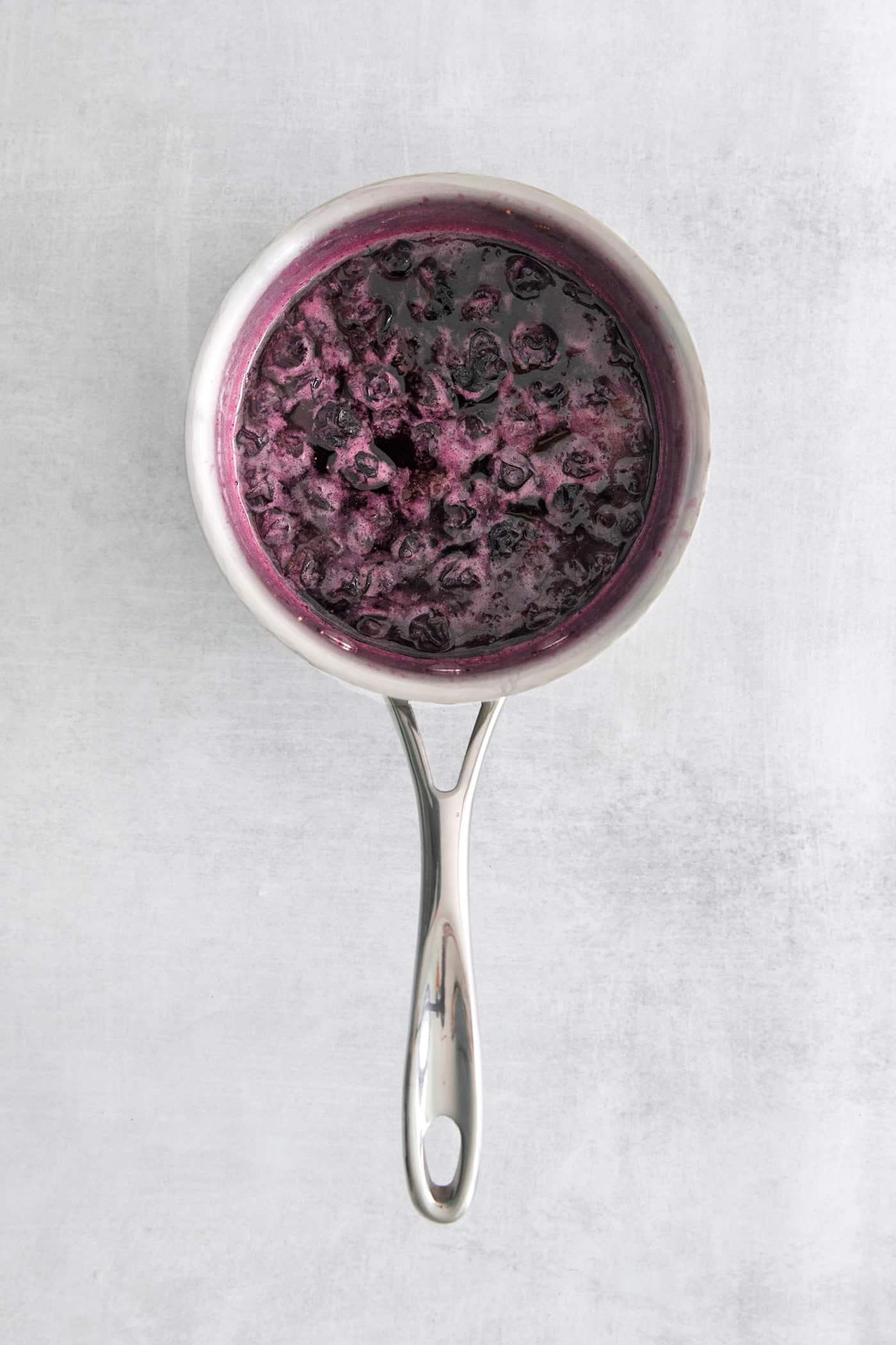 Made with flavored simple syrup, this Blueberry Margarita is just the fruity cocktail for summer. Sweet but tart and super refreshing! Blueberry simple syrup in a pan