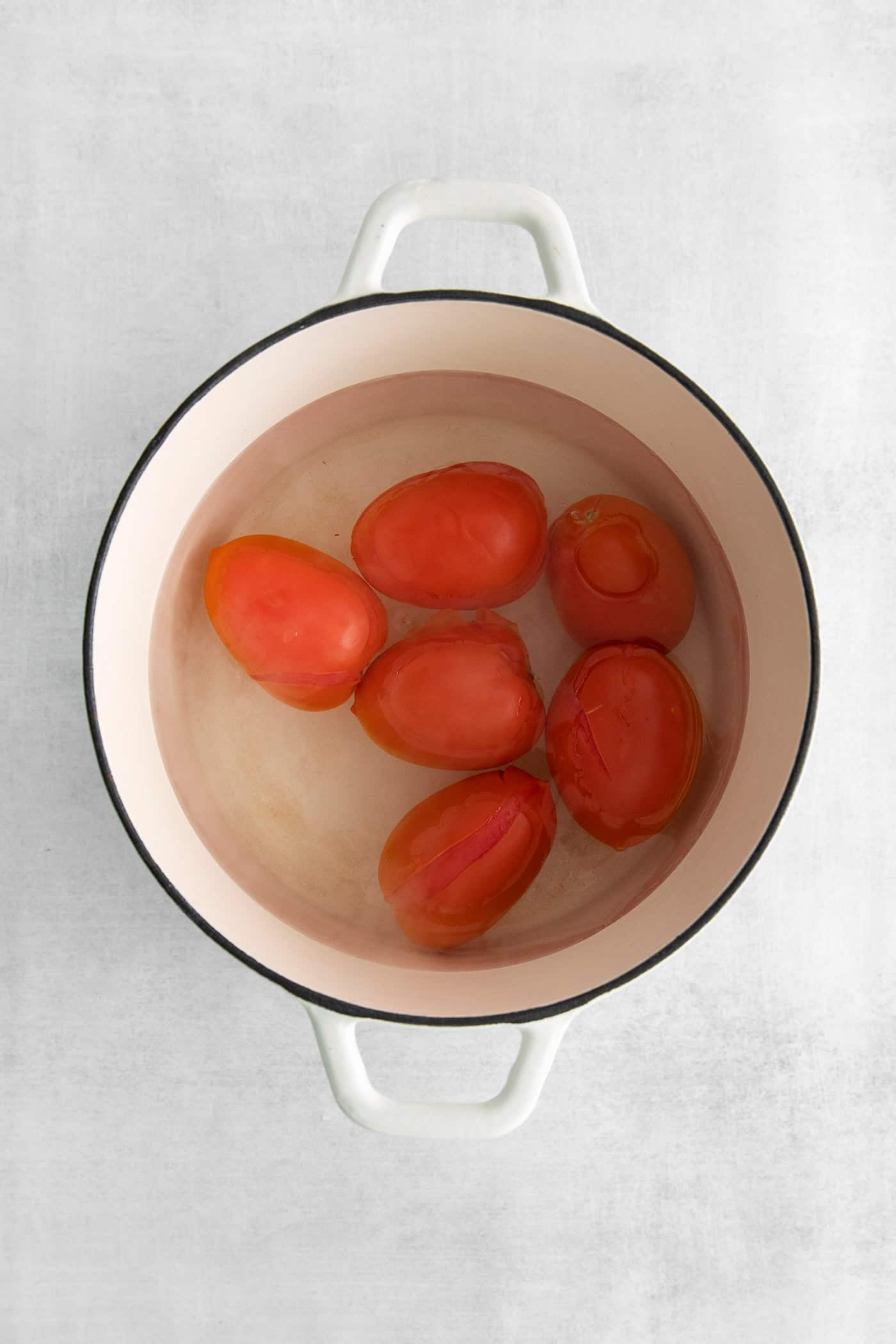 Made with juicy tomatoes, celery, onion, and green pepper these Chili Stewed Tomatoes make a mouthwatering side dish. Roma tomatoes in a pot of water
