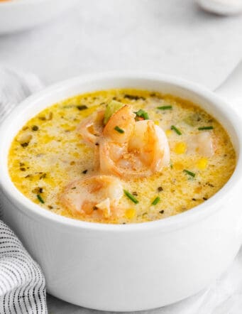 Angled view of a bowl of shrimp and corn chowder