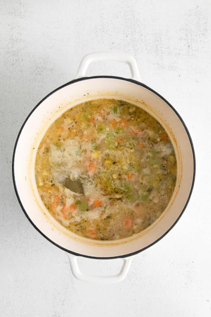 This shrimp and corn chowder has a light, creamy broth and is filled with sautéed vegetables, tender shrimp, and fresh sweet corn. Corn chowder broth in a pot
