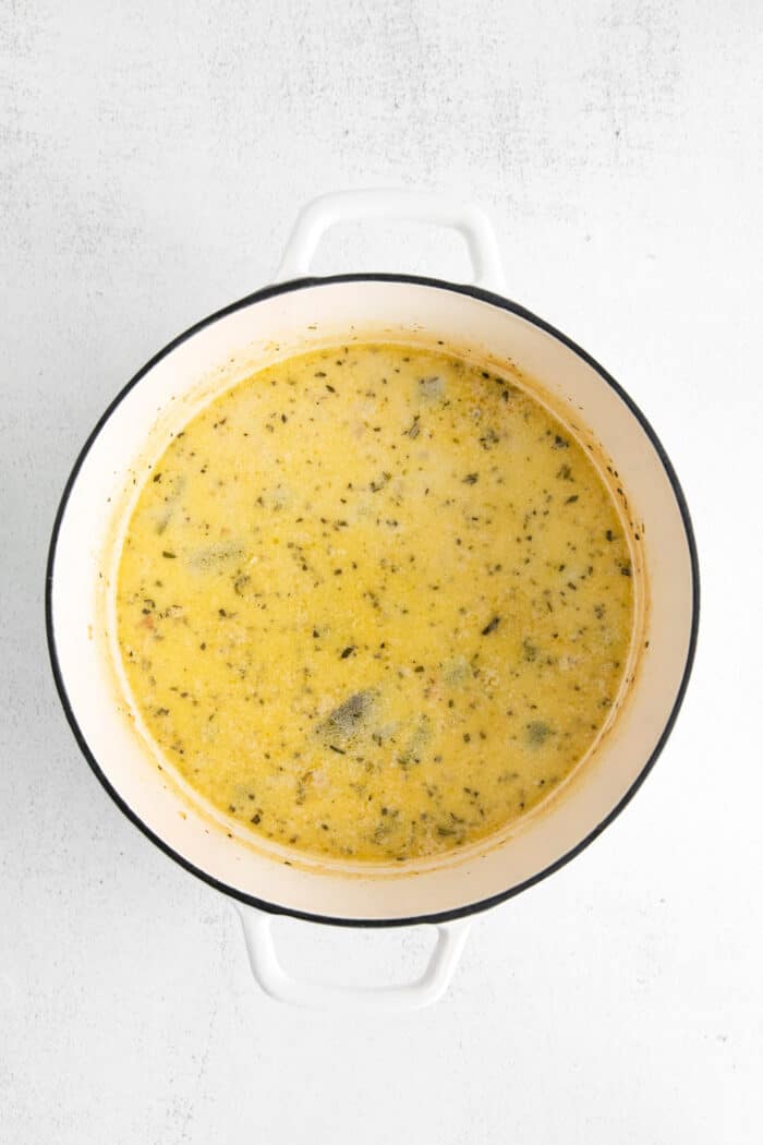 This shrimp and corn chowder has a light, creamy broth and is filled with sautéed vegetables, tender shrimp, and fresh sweet corn. Overhead view of shrimp corn chowder in a pot