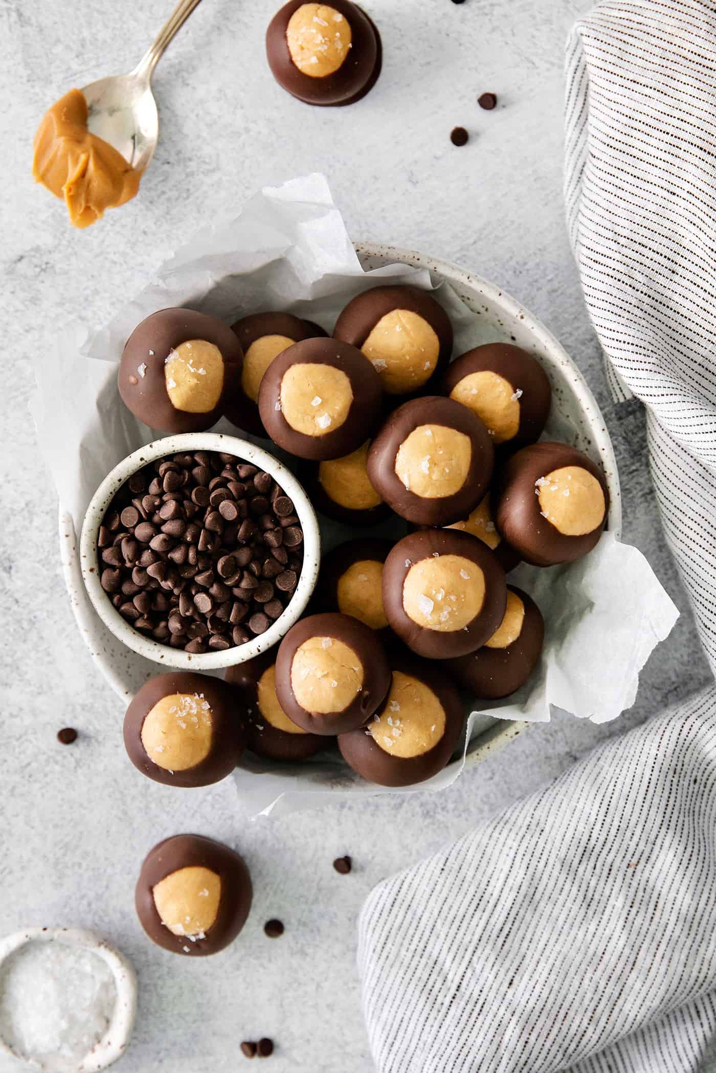 These Homemade Buckeyes feature creamy peanut butter balls dipped in rich, smooth semi-sweet chocolate. Just 7 ingredients! Overhead view of buckeyes in a bowl