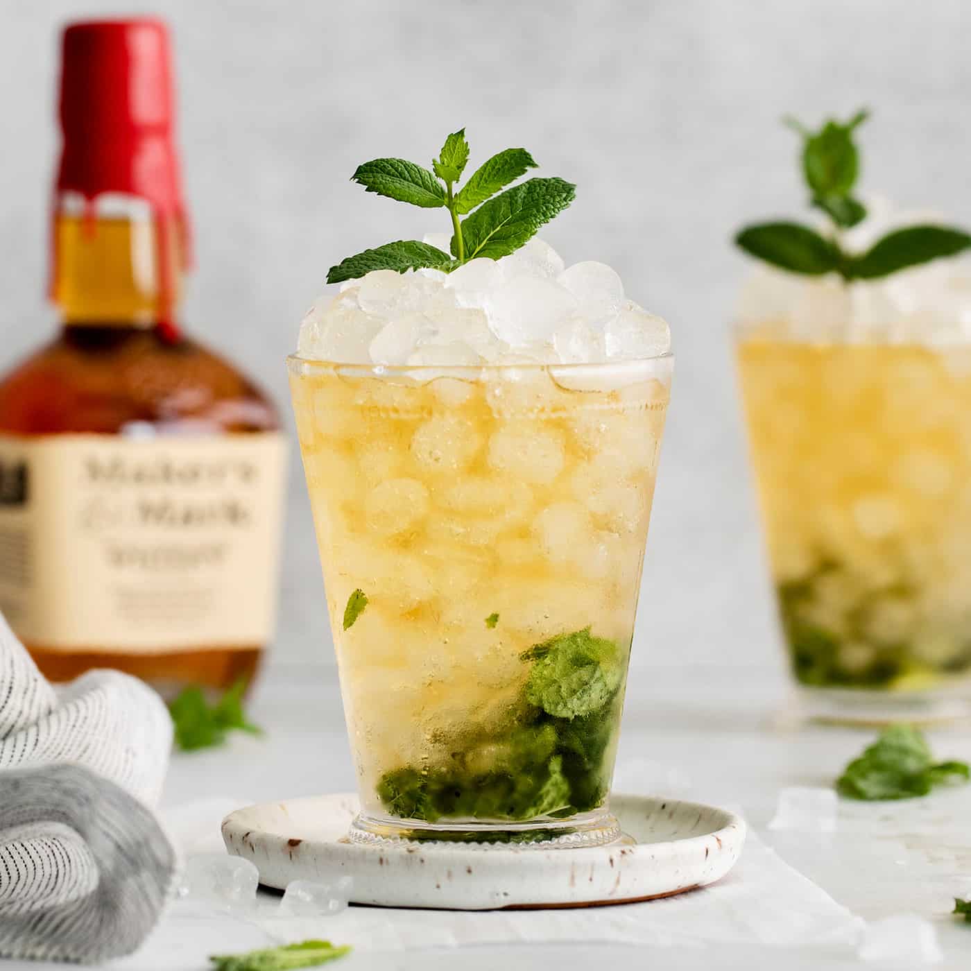 This classic Mint Julep is bright and refreshing, with fresh mint and bourbon. You only need 3 ingredients and a few minutes to make this! Two mint julep cocktails