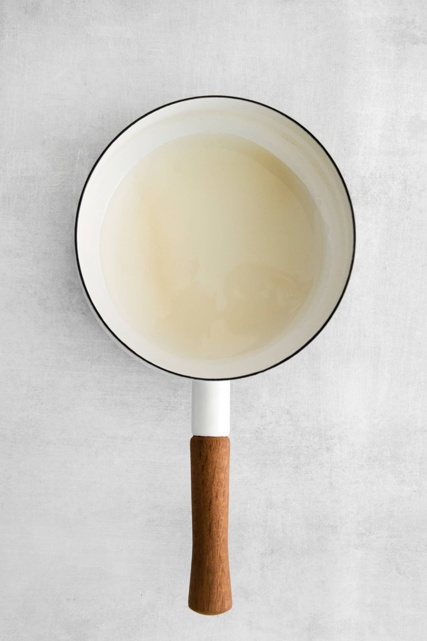 This Salted Caramel Ice Cream features a sweet and creamy ice cream base with homemade caramel sauce swirled throughout. Sugar and water in a saucepan