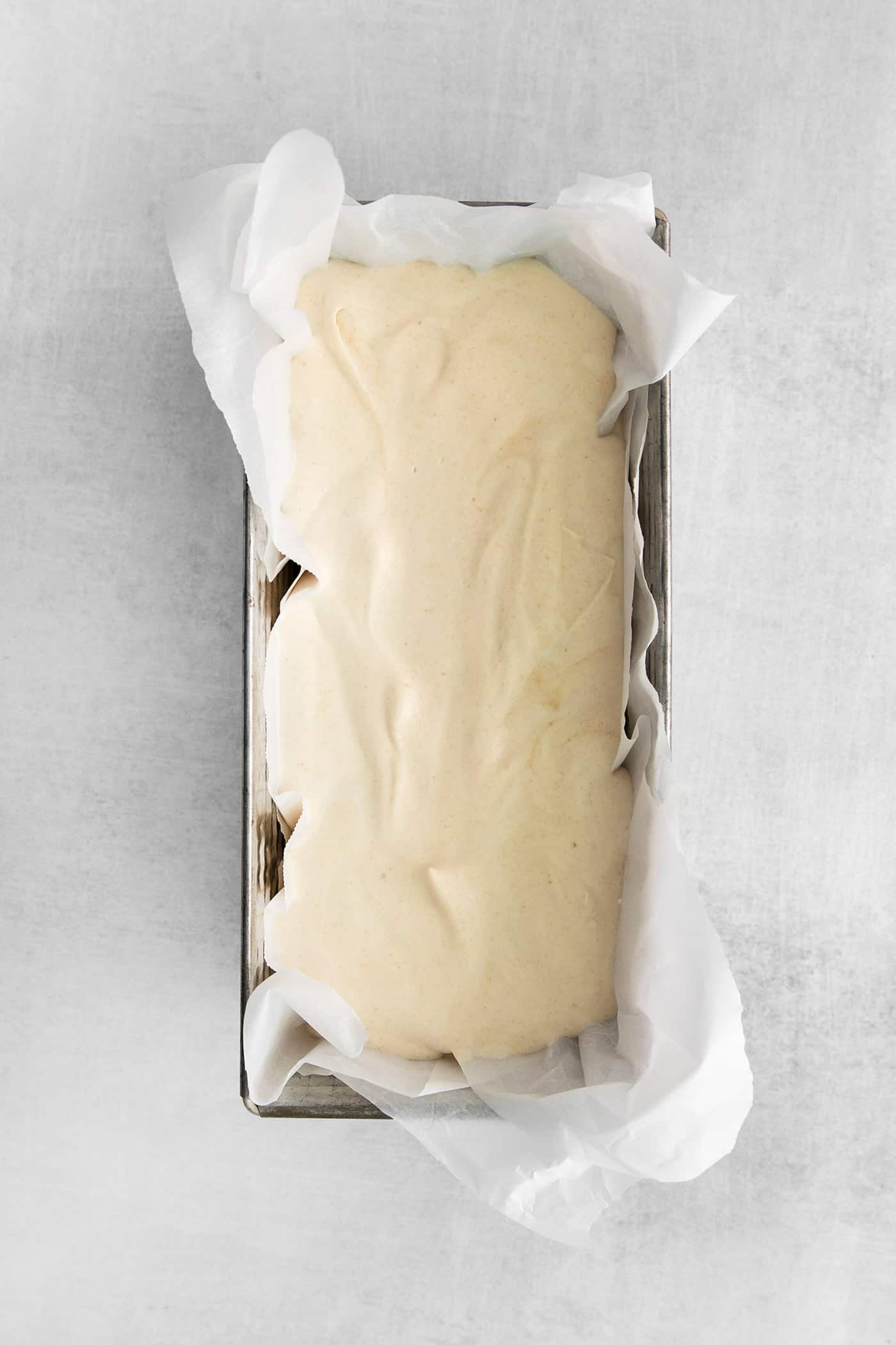 This Salted Caramel Ice Cream features a sweet and creamy ice cream base with homemade caramel sauce swirled throughout. homemade ice cream in a loaf pan