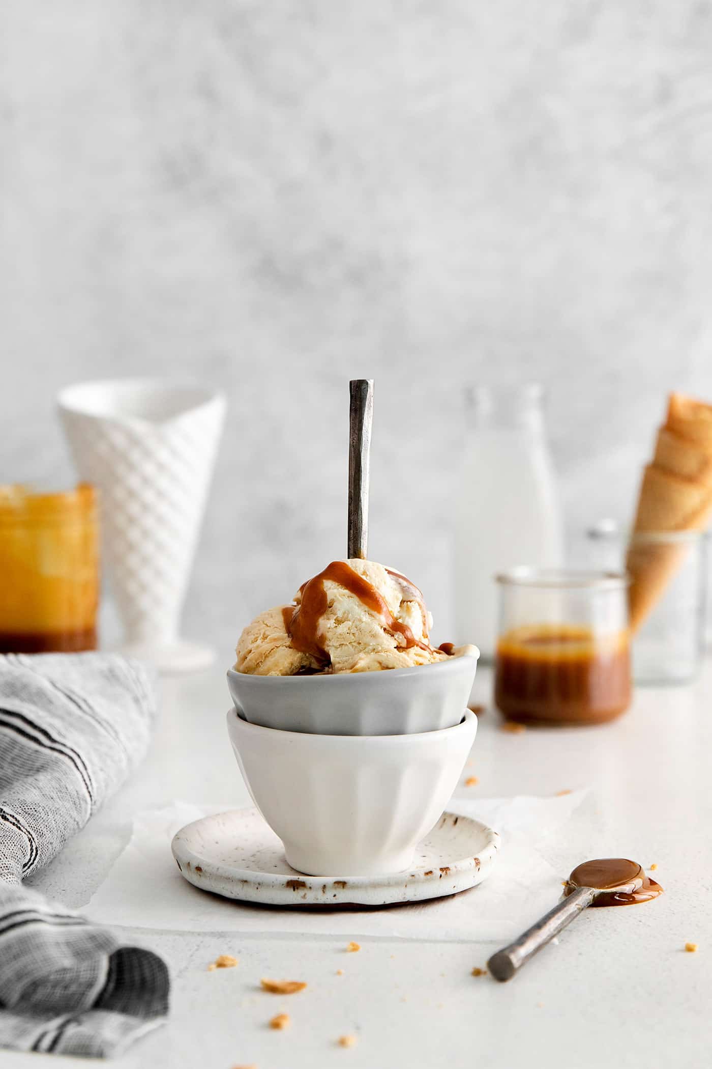 This Salted Caramel Ice Cream features a sweet and creamy ice cream base with homemade caramel sauce swirled throughout. A bowl of homemade salted caramel ice cream