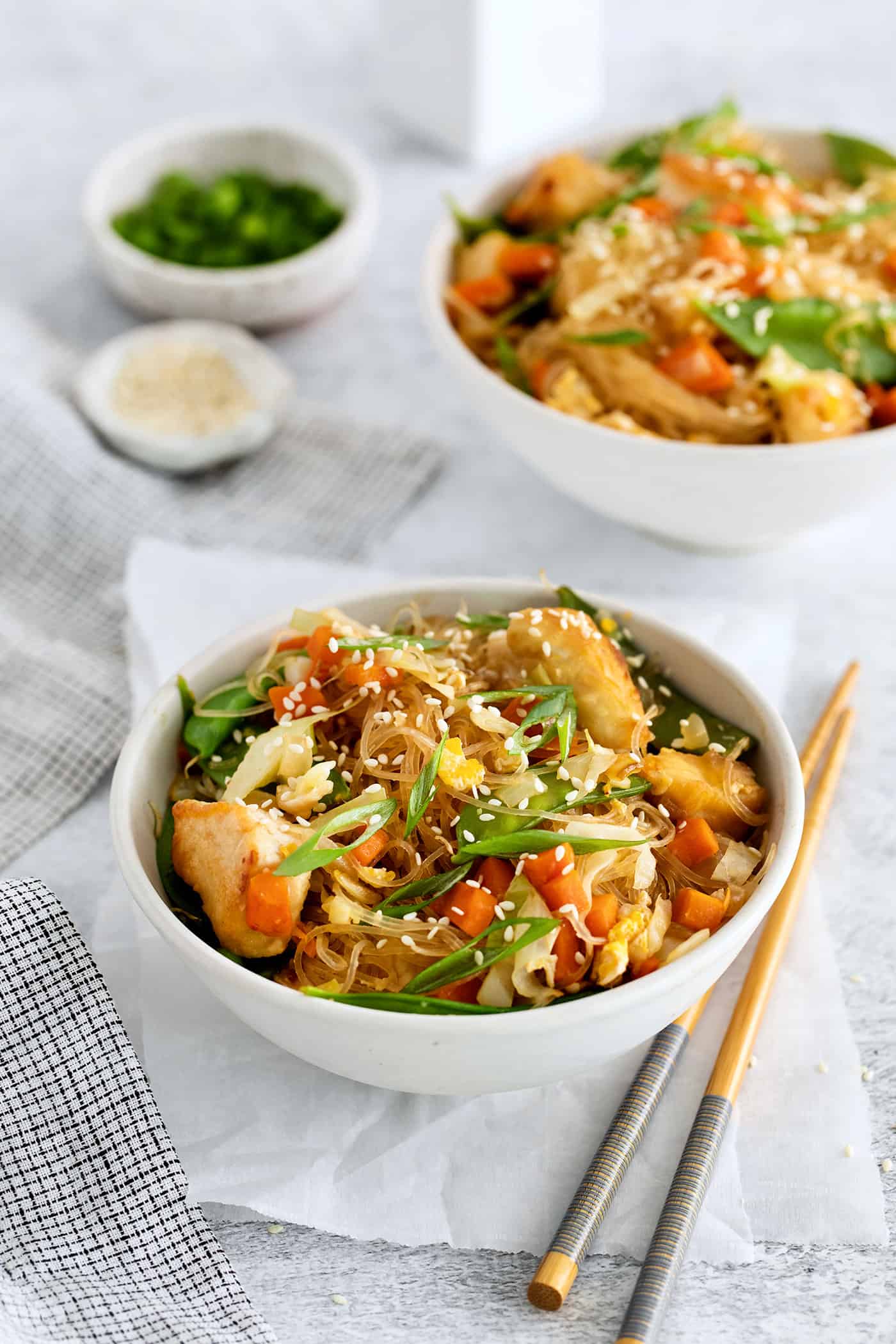 Made with glass noodles, mixed vegetables, and a savory soy glaze, Pad Woon Sen is an easy Thai stir fry that's ready in just 30 minutes! Angled view of a bowl of Thai glass noodle stir fry with chicken