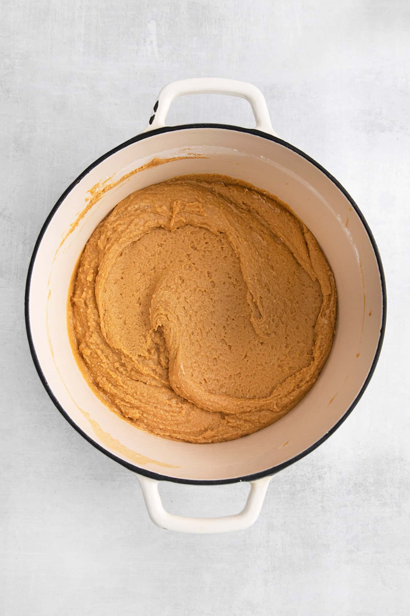 Made with 7 ingredients, this Homemade Peanut Butter Fudge is rich, creamy, and easy to make. It's the perfect fudge for the holidays! Peanut butter mixture in a saucepot