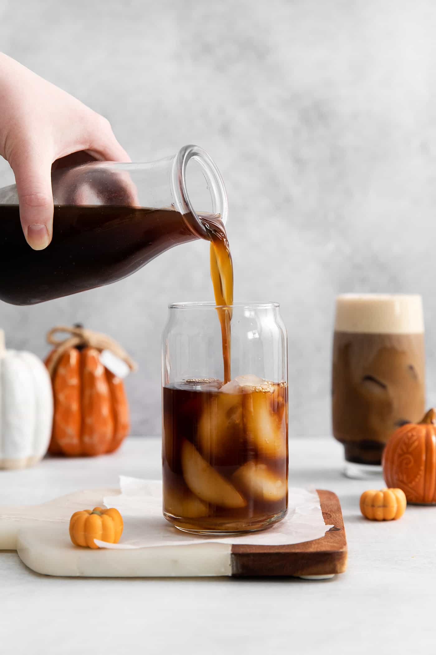 Lightly sweetened cold brew topped with a rich foam., this Pumpkin Cream Cold Foam is a Starbucks copycat you must try. A hand pouring cold brew over ice