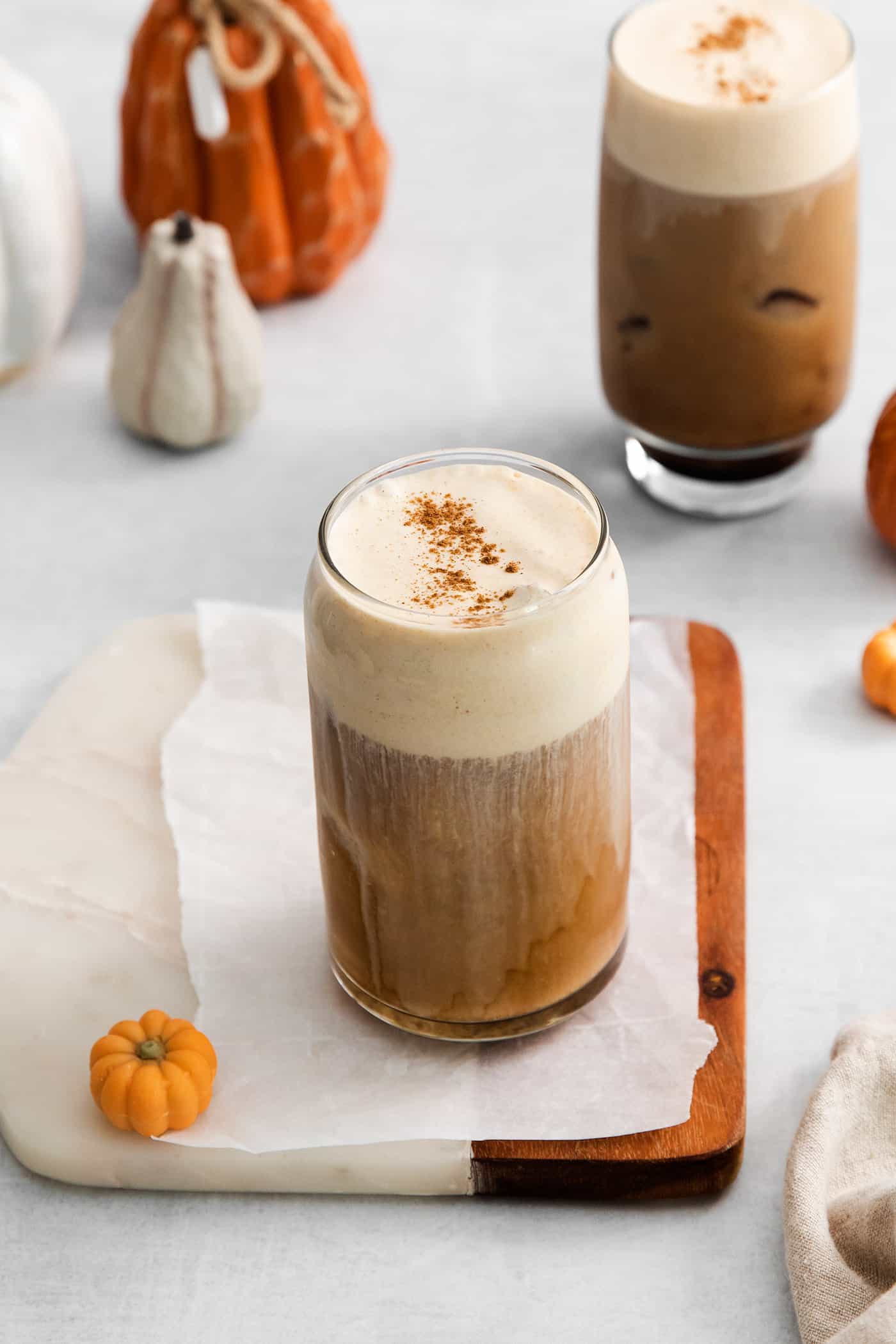 Lightly sweetened cold brew topped with a rich foam., this Pumpkin Cream Cold Foam is a Starbucks copycat you must try. Angled view of a pumpkin cream cold brew