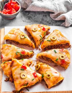 Mexican pizza, cut into pieces