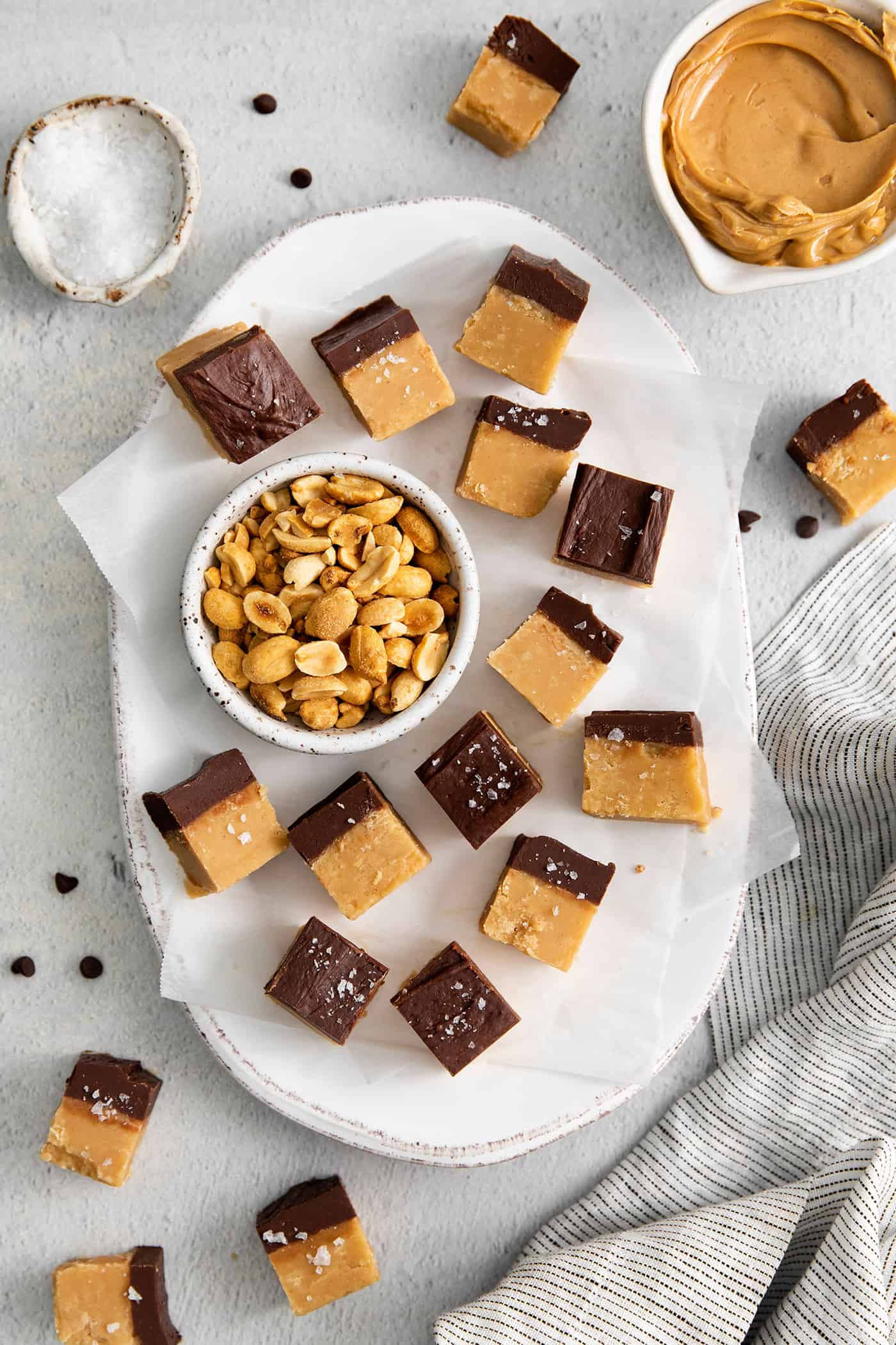 This Buckeye Fudge is a fun twist on traditional buckeyes, with smooth, creamy peanut butter fudge topped with a layer of rich chocolate. Overhead view of pieces of chocolate peanut butter fudge