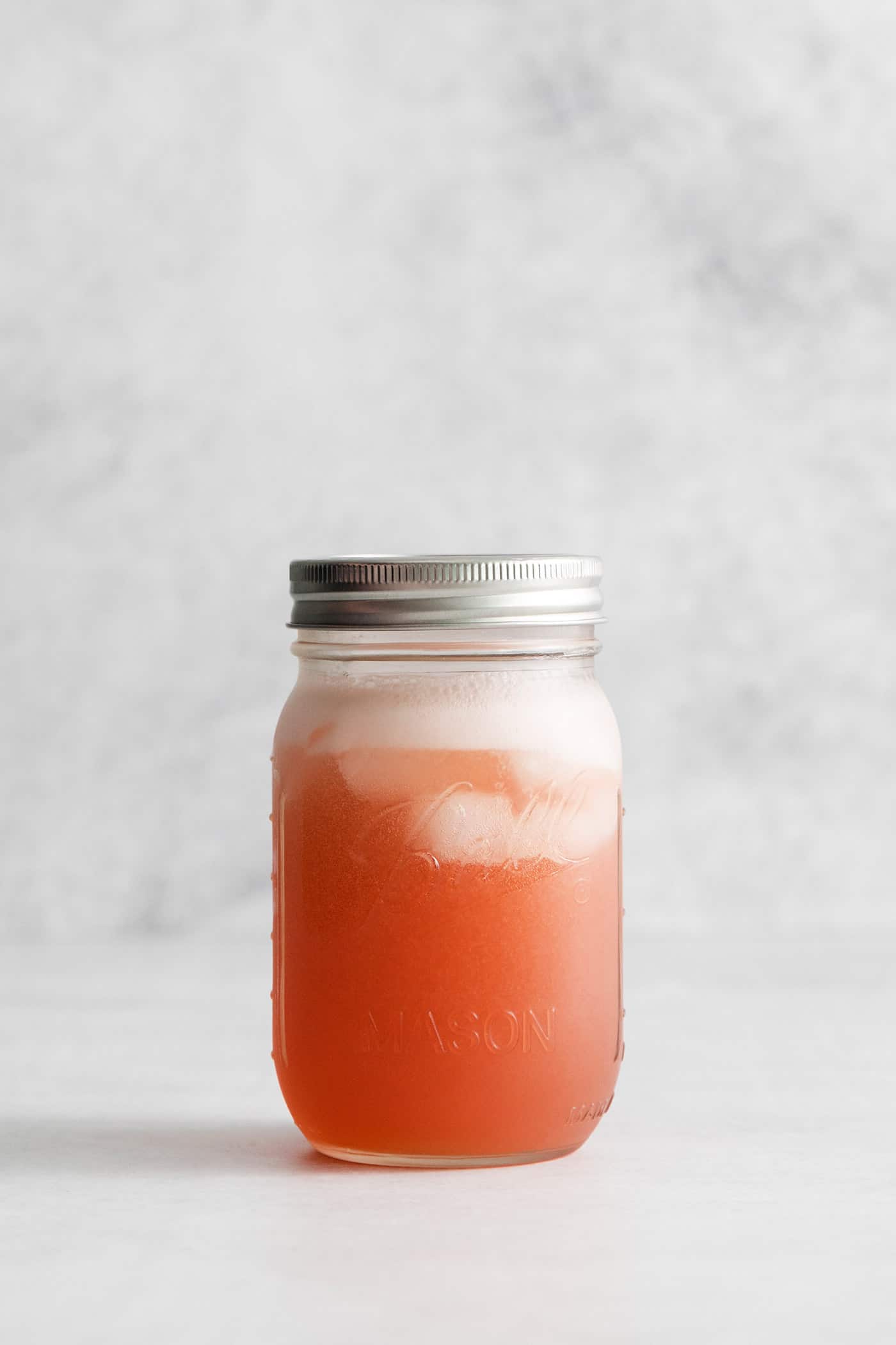 This Cranberry Margarita is tart and refreshing with flavors of cranberry and lime. A great Christmas margarita option! Cranberry margarita in a mason jar