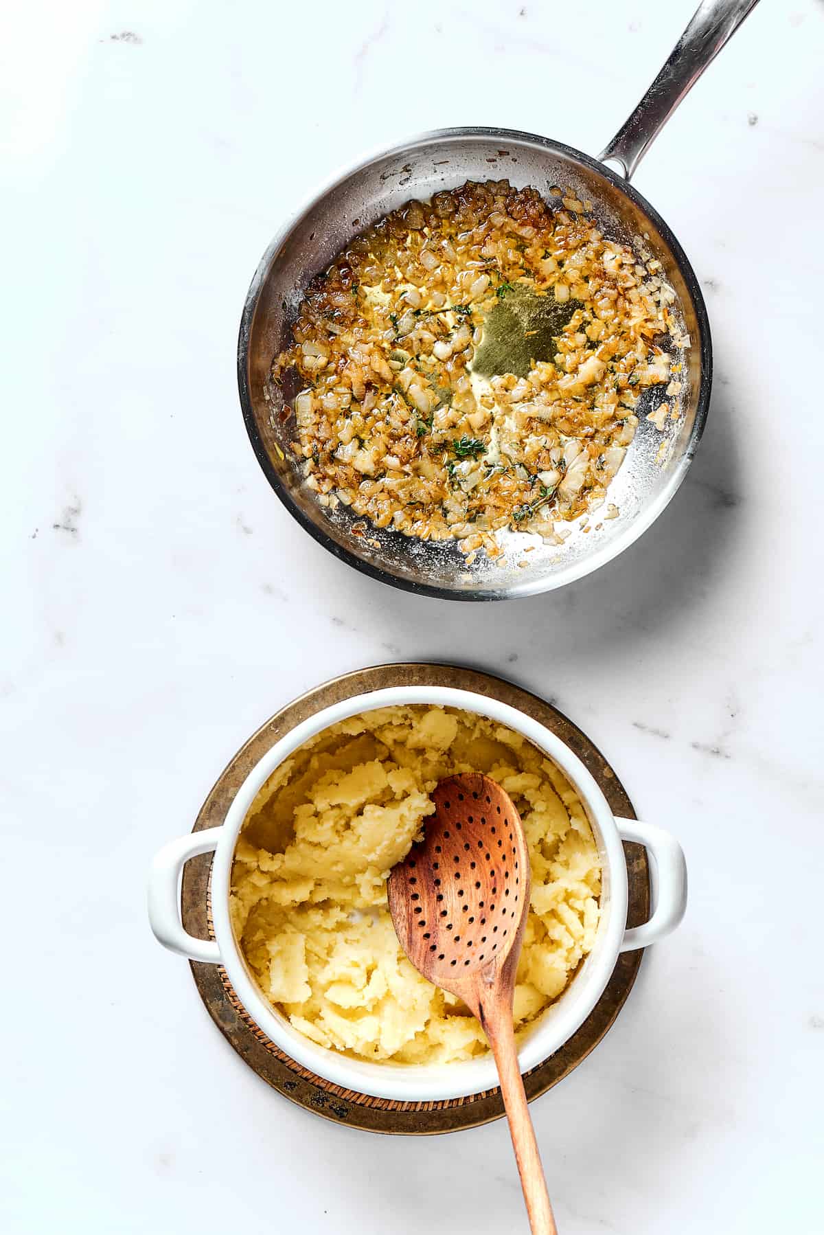Potato Knishes are a popular Jewish recipe featuring a mashed potato and onion filling wrapped in a thin, flaky dough and baked to golden. Mashed potatoes in a bowl and sauteed onions in a pan