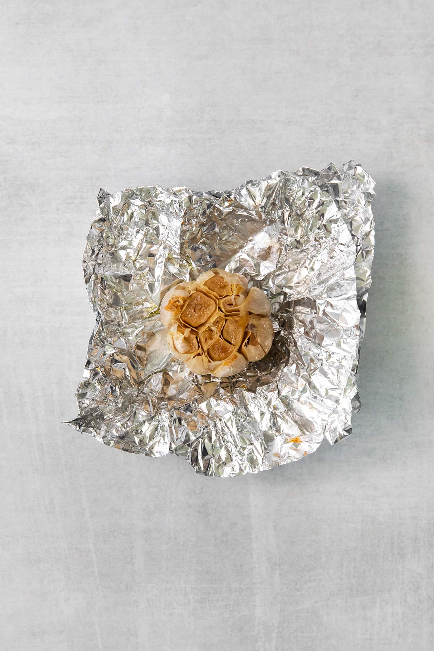 Parsnip Puree is a tasty side dish that is simple enough for every day but impressive enough for the holidays! Roasted garlic on a piece of foil