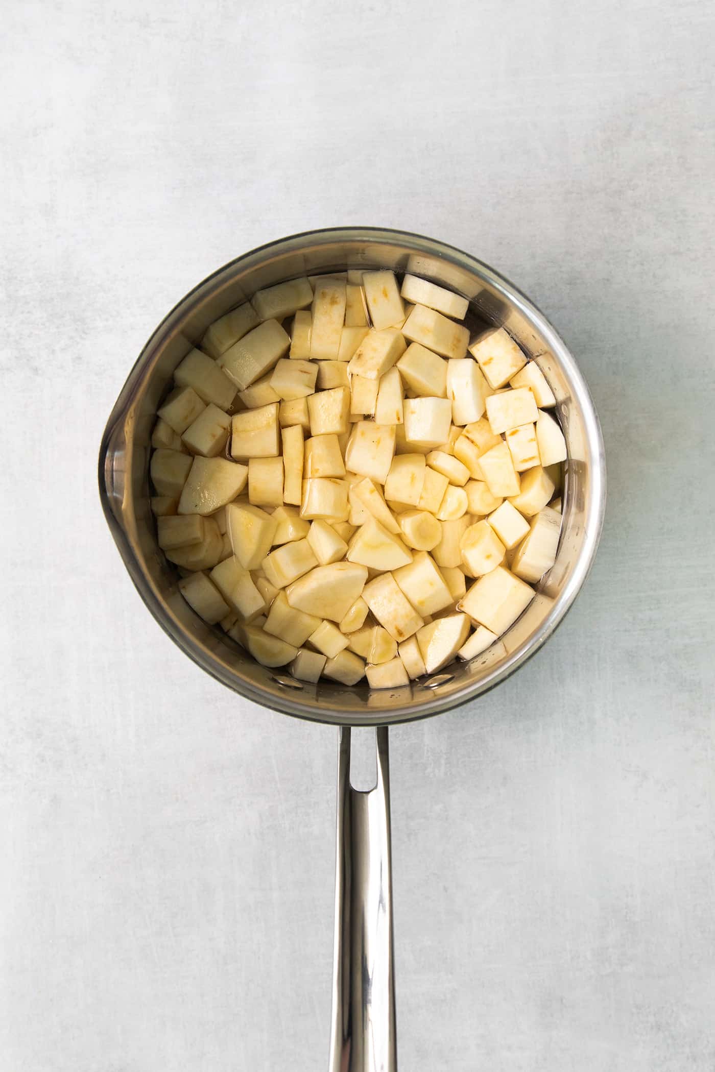 Parsnip Puree is a tasty side dish that is simple enough for every day but impressive enough for the holidays! Chopped parsnip in a pot of water