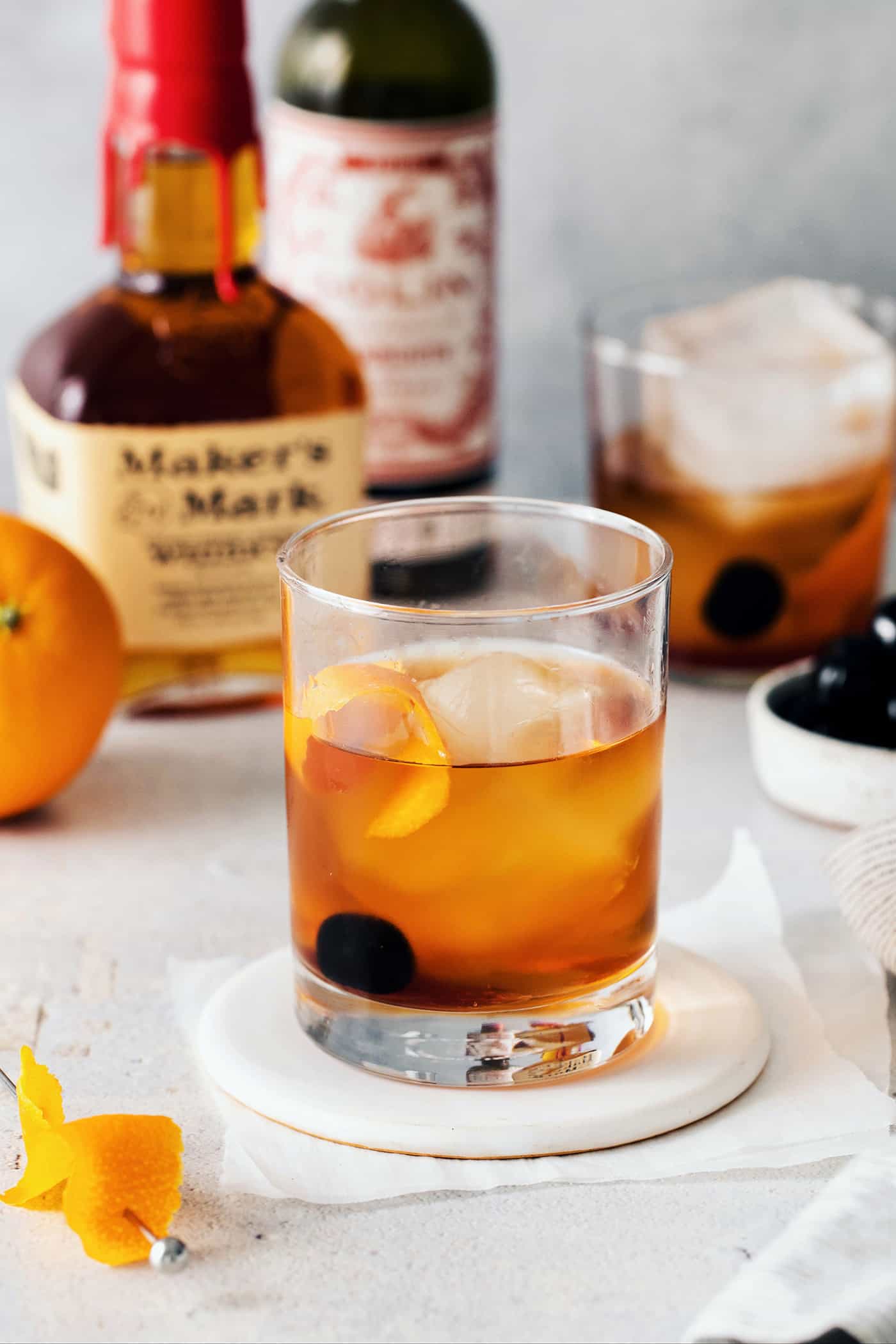 This classic Manhattan is a strong and earthy cocktail with just a hint of sweetness. Fancy and elegant, with 3 ingredients. A Manhattan cocktail on a coaster
