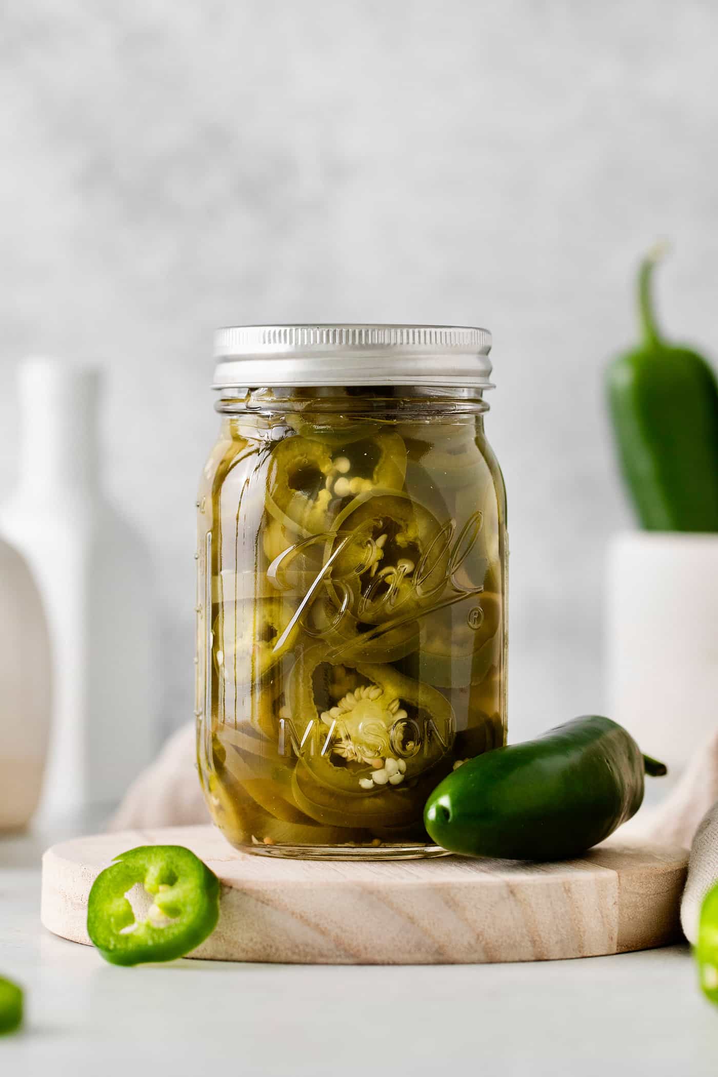 With just 5 ingredients, these Pickled Jalapenos are spicy and tangy. Add them to sandwiches and salads or straight from the jar. A jar of quick pickled jalapenos