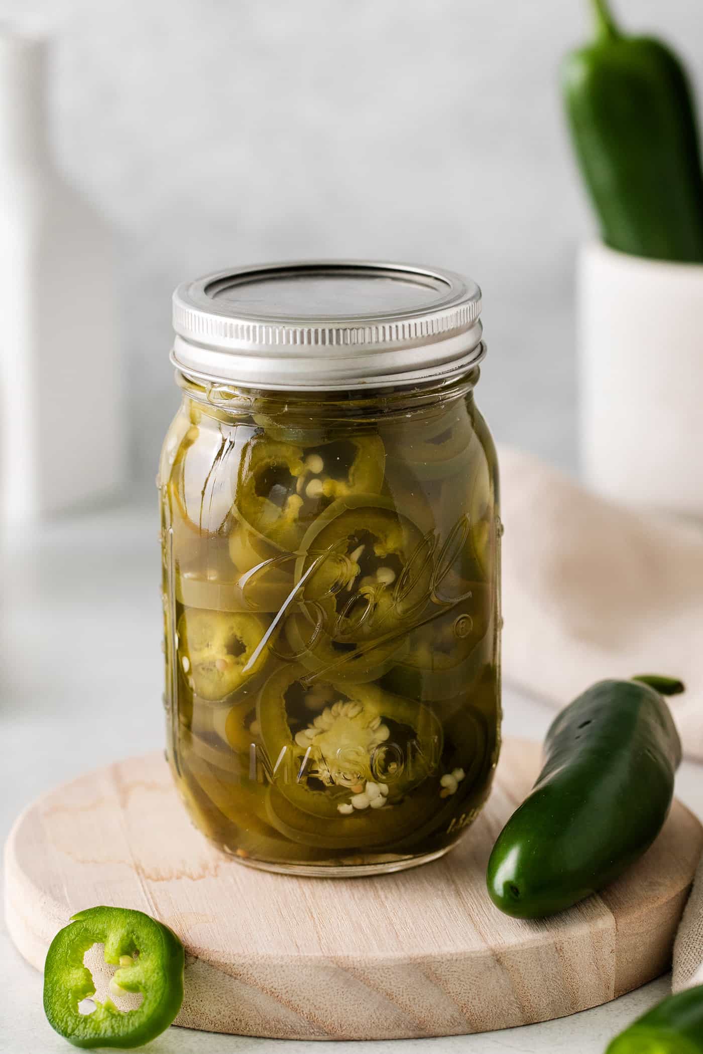With just 5 ingredients, these Pickled Jalapenos are spicy and tangy. Add them to sandwiches and salads or straight from the jar. A jar of quick pickled jalapenos