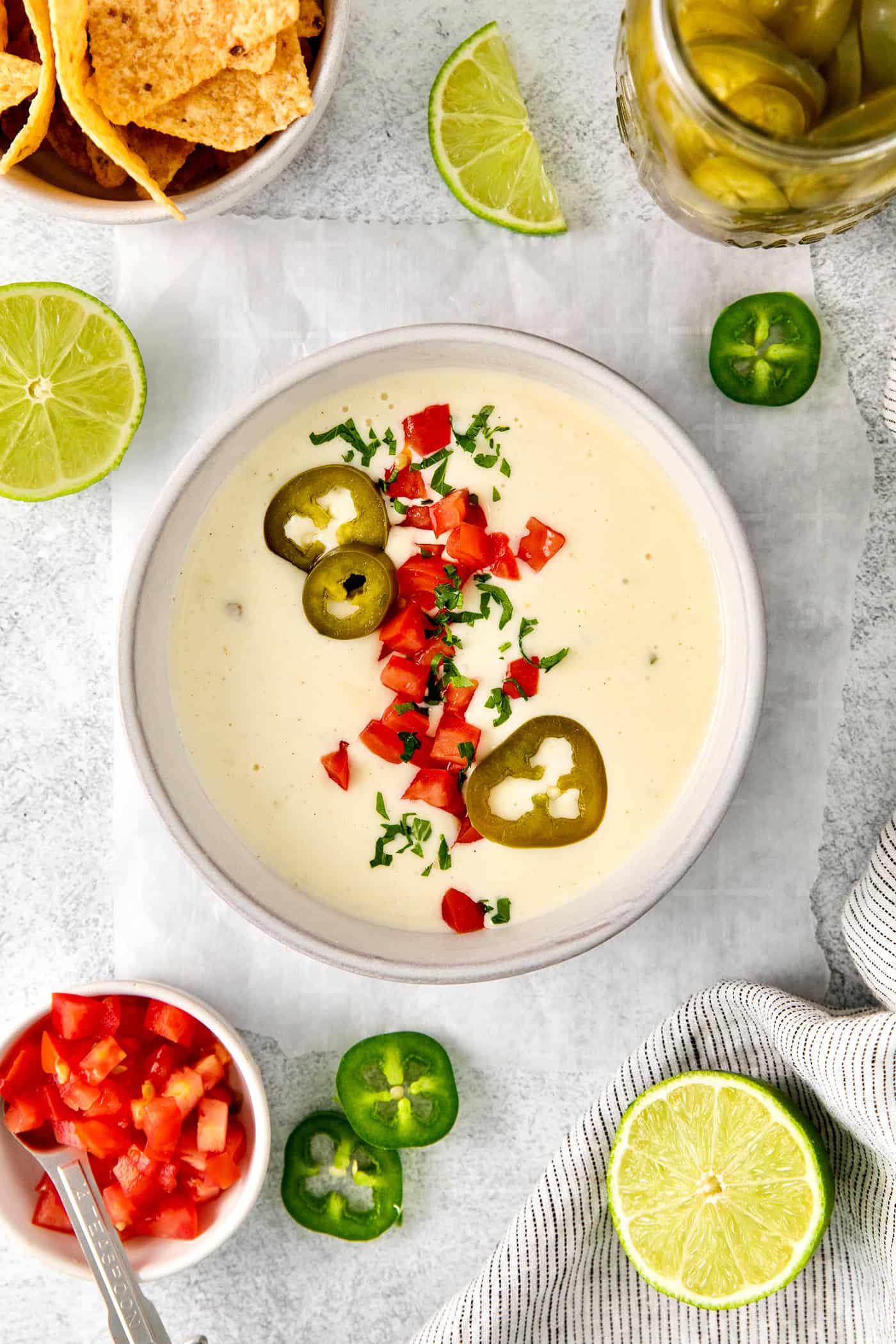 Smooth and creamy with just the right amount of heat, this Homemade Queso Blanco is made with just 5 ingredients! Quick & easy! A bowl of white queso dip